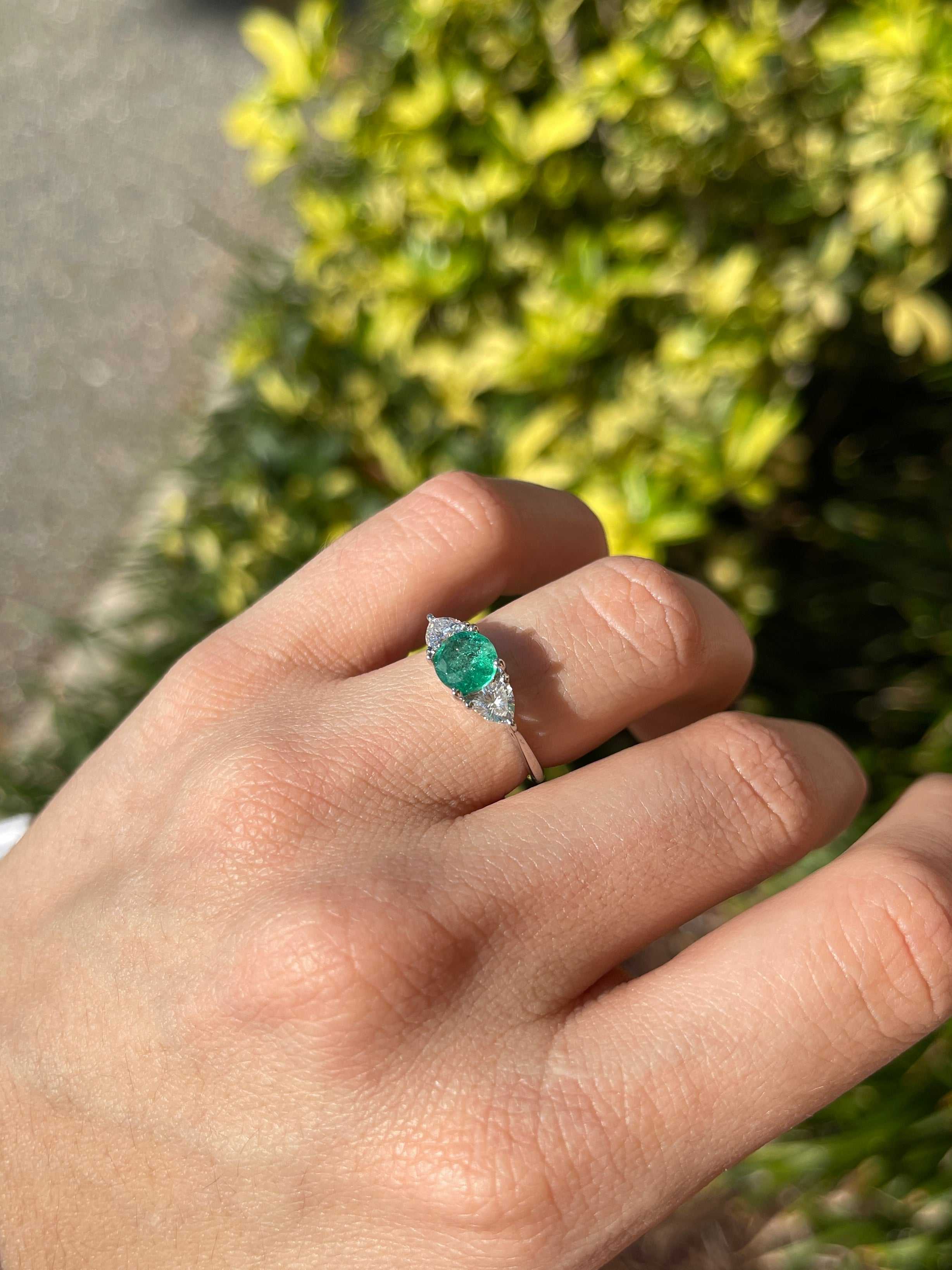 Natural round emerald and trillion lab diamond three-stone ring in 14K gold by JR Colombian Emeralds, showcasing sparkling gemstones.