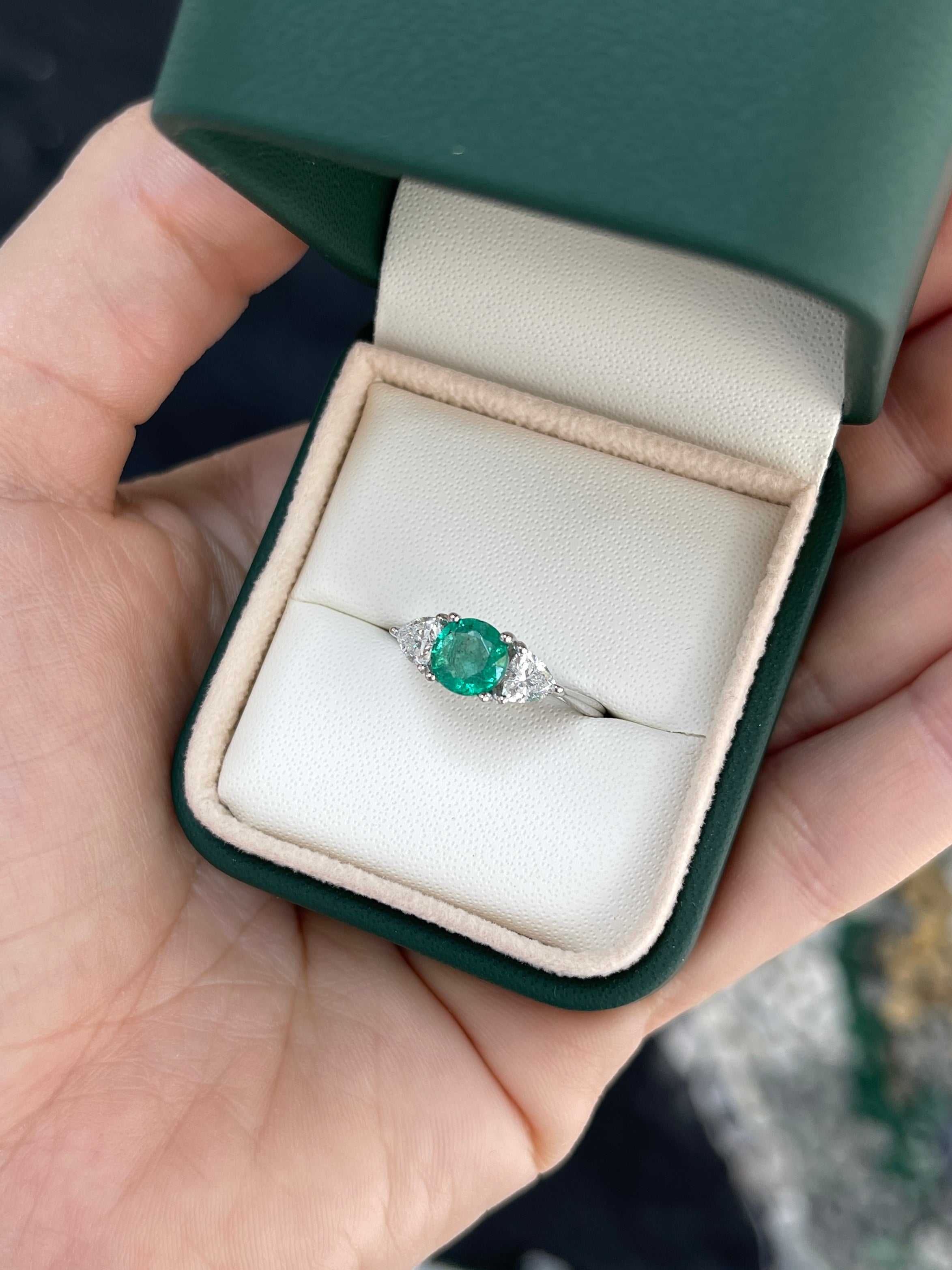 Natural round emerald and trillion lab diamond three-stone ring in 14K gold by JR Colombian Emeralds, detailed close-up of the jewelry.