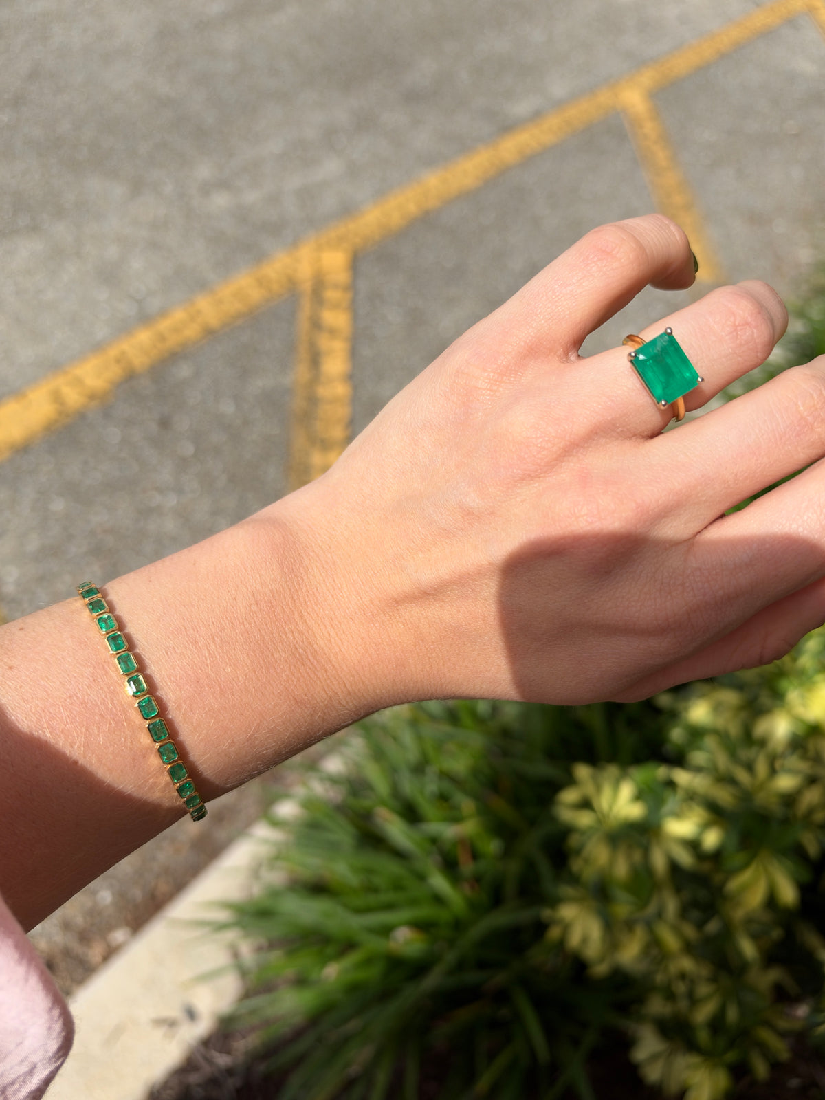 14K gold emerald tennis bracelet with east-west bezel-set gemstones, featuring 6.69 tcw from JR Colombian Emeralds in IMG_1564.jpg
