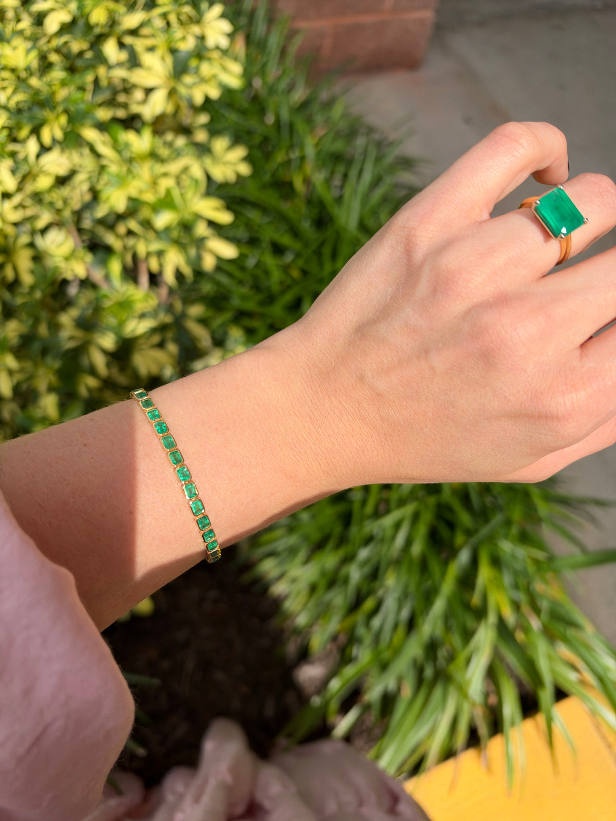 East to West bezel set emerald tennis bracelet with 6.69 carats total weight in 14K gold by JR Colombian Emeralds.