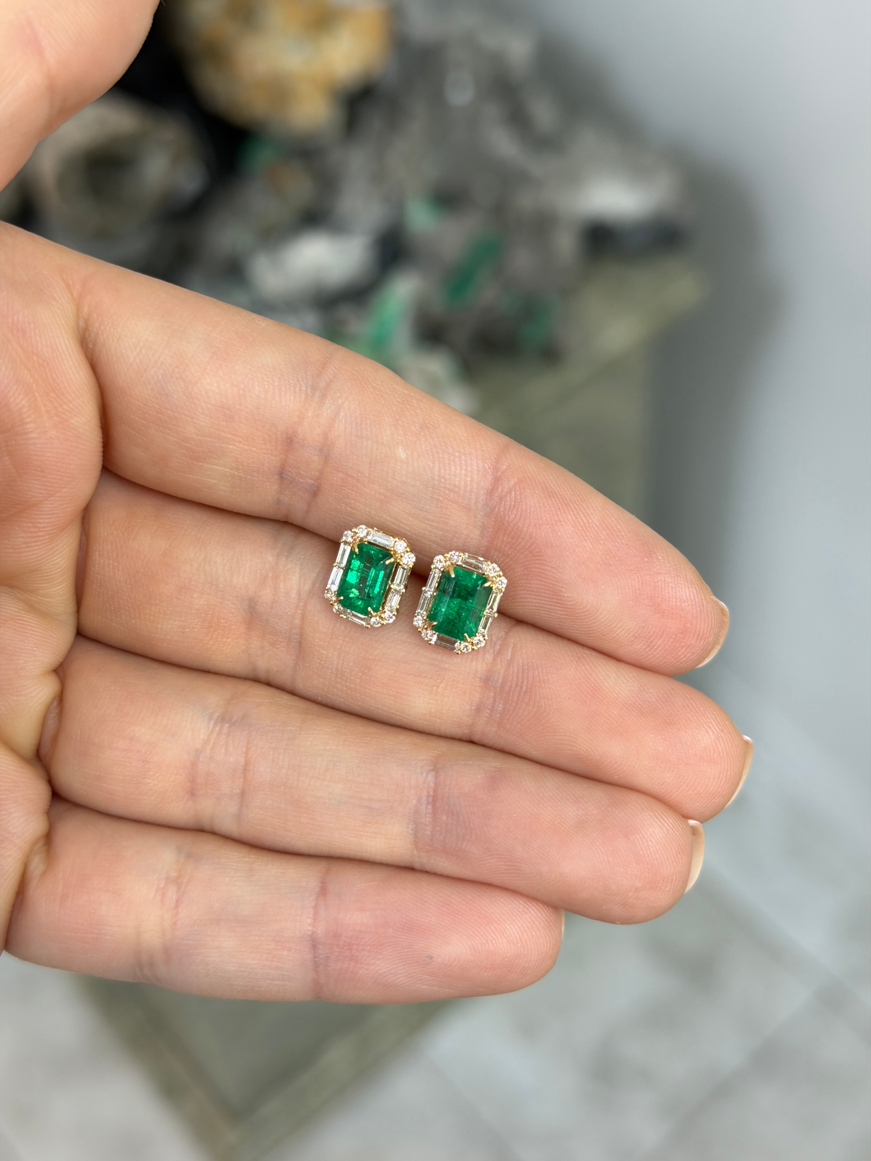 18K gold emerald and diamond halo stud earrings featuring rich green emeralds and baguette diamonds by JR Colombian Emeralds