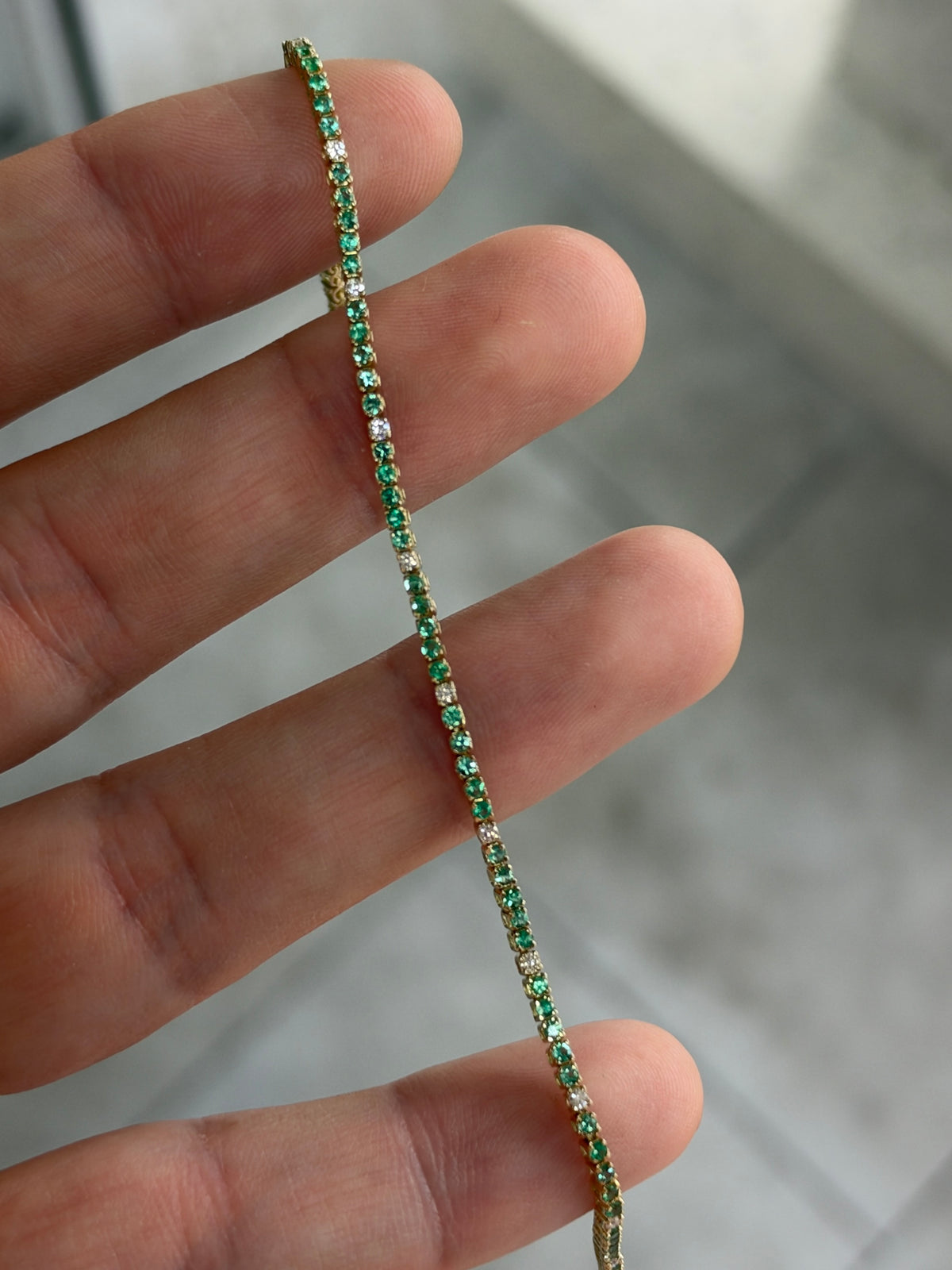 Petite 1.14tcw emerald and diamond tennis bracelet in 14K yellow gold, 7-inch length, by JR Colombian Emeralds.