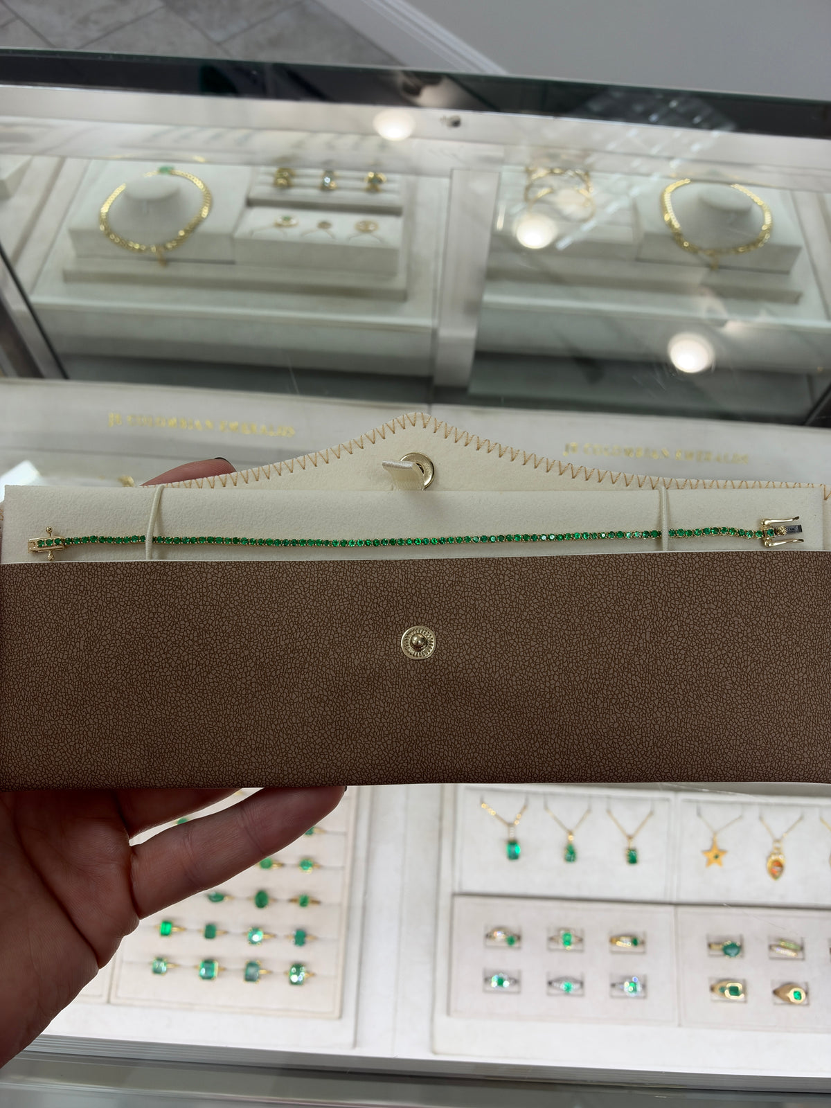 Petite 1.72tcw round emerald tennis bracelet in 14K gold by JR Colombian Emeralds, 7-inch length, showcasing elegant green gemstones.