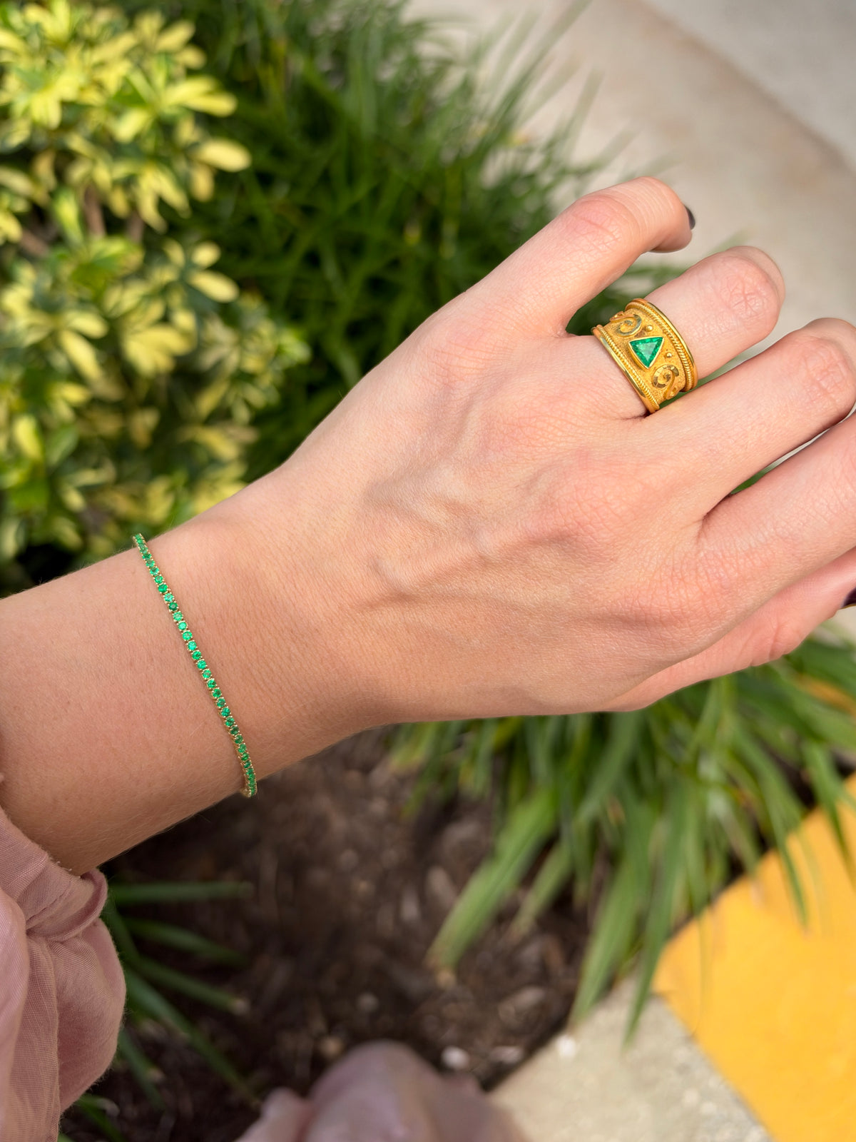 Petite 1.72tcw round emerald tennis bracelet in 14K gold by JR Colombian Emeralds, 7-inch length, close-up of bracelet detail.