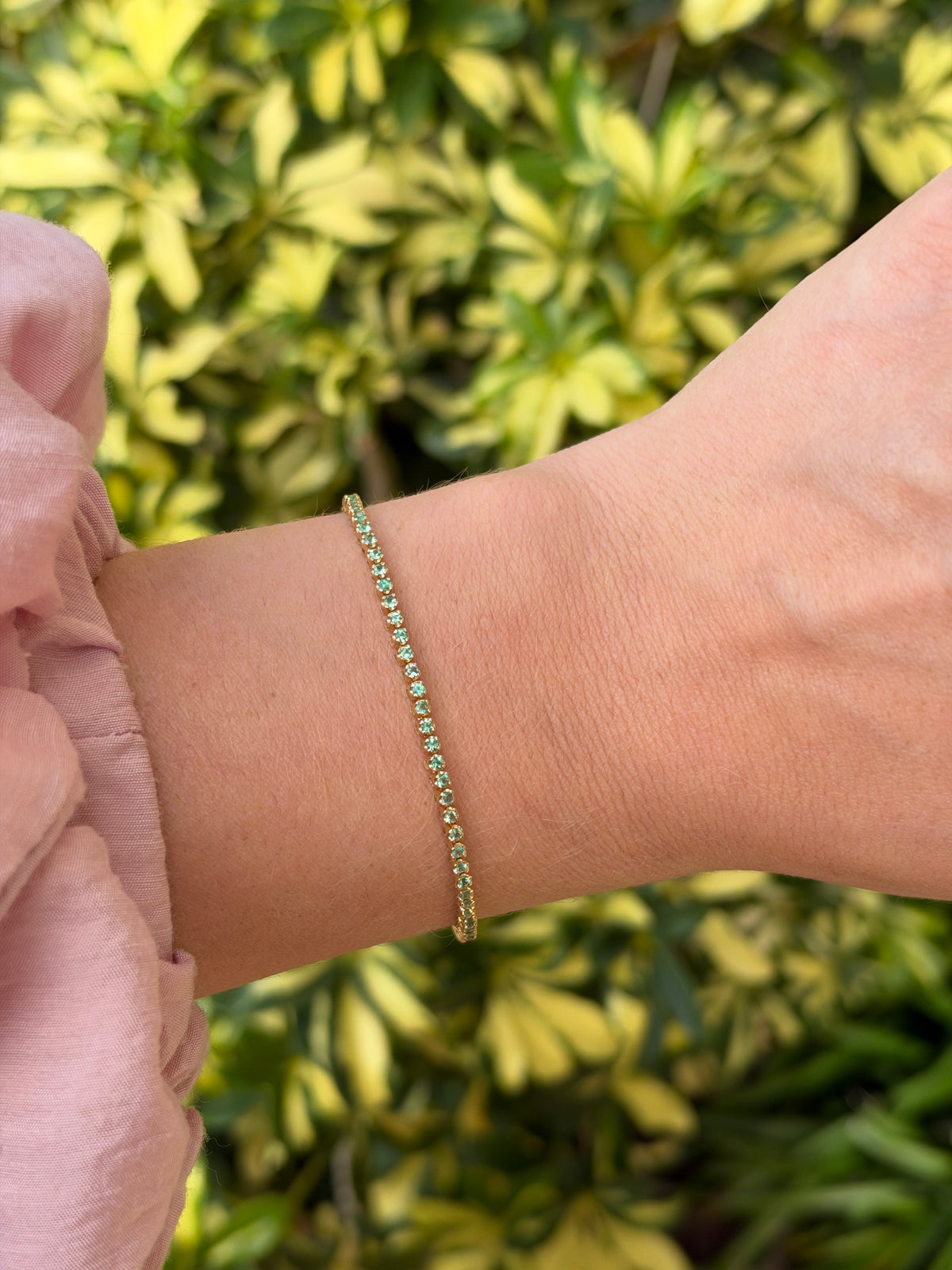 Light green round emerald tennis bracelet with 0.63tcw in 14K gold, 7-inch petite design by JR Colombian Emeralds.