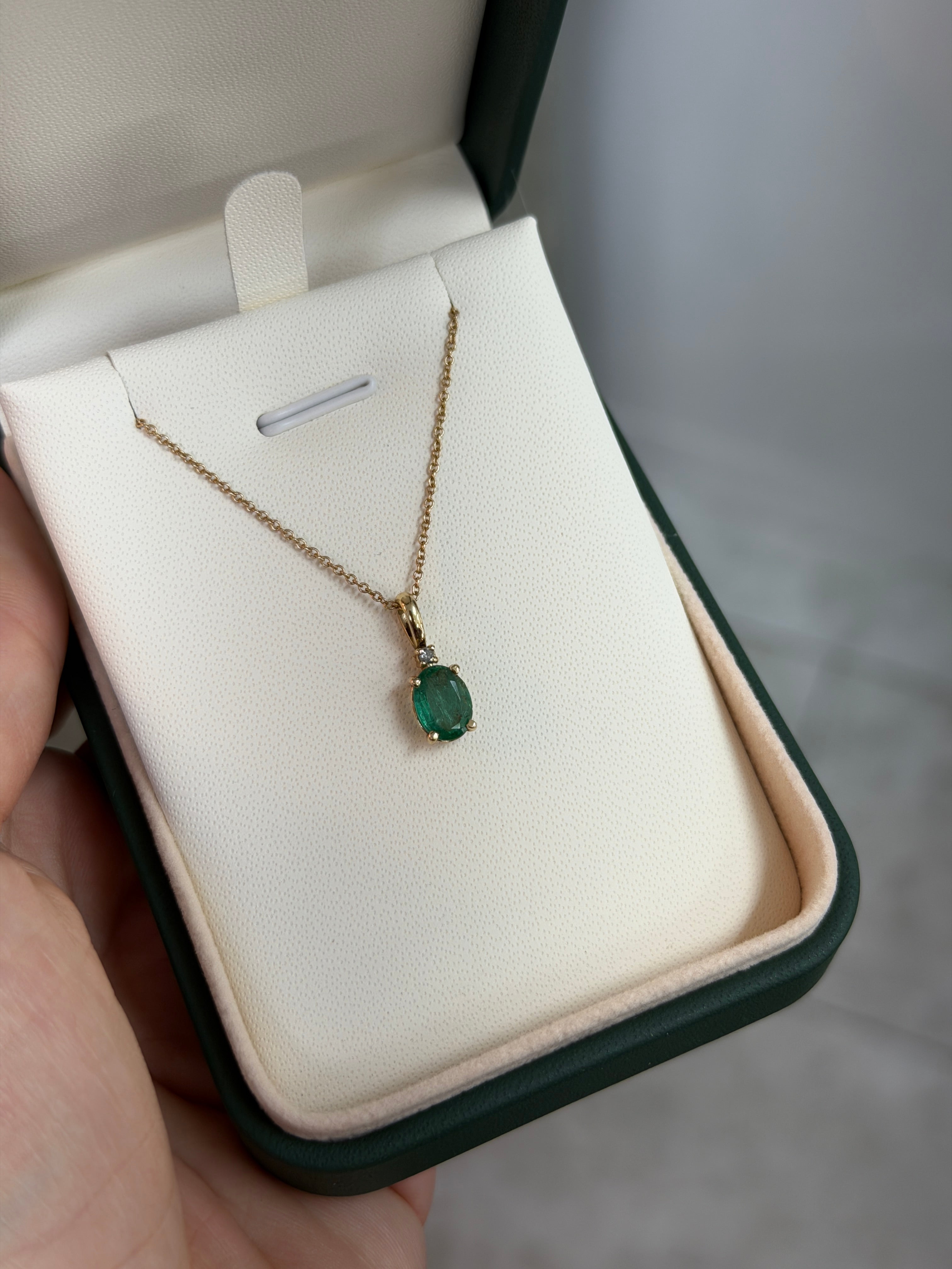14K yellow gold pendant necklace with 1.30tcw oval cut natural emerald and diamond accents, jewelry by JR Colombian Emeralds.
