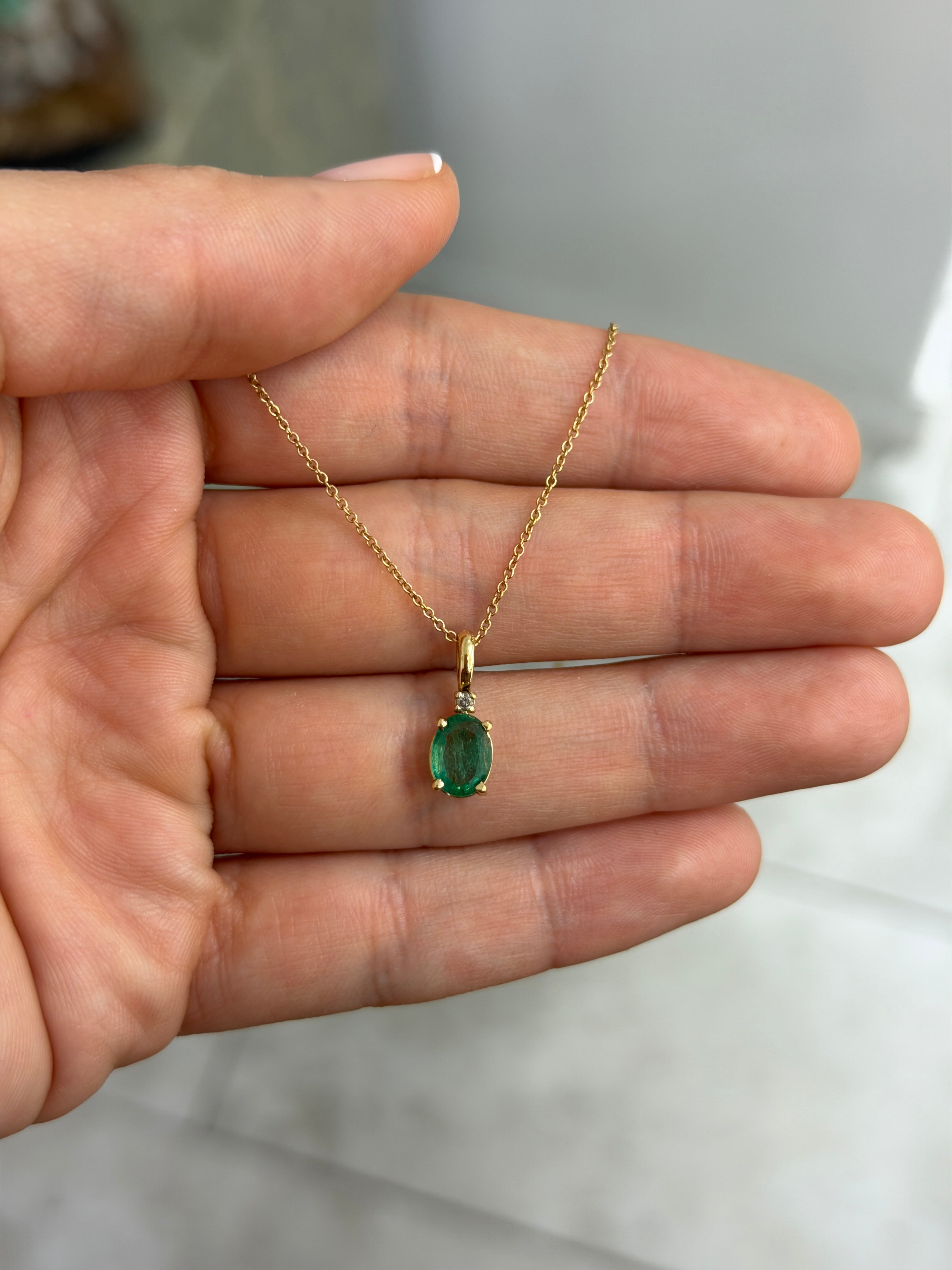 14K yellow gold pendant necklace with 1.30tcw oval cut natural emerald and diamond accents, by JR Colombian Emeralds.