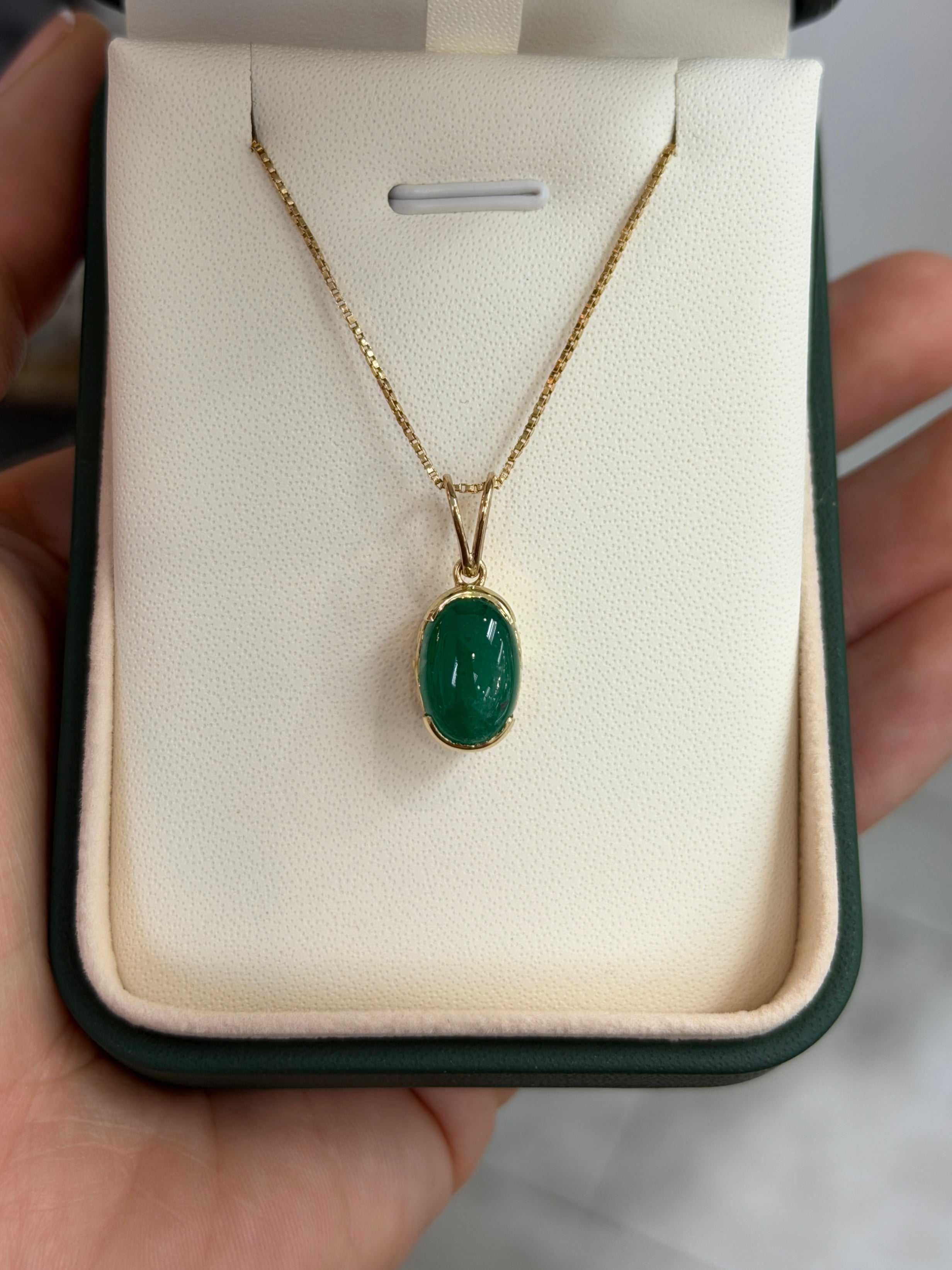 3.67 carat oval Colombian emerald cabochon pendant necklace in 14K yellow gold box chain