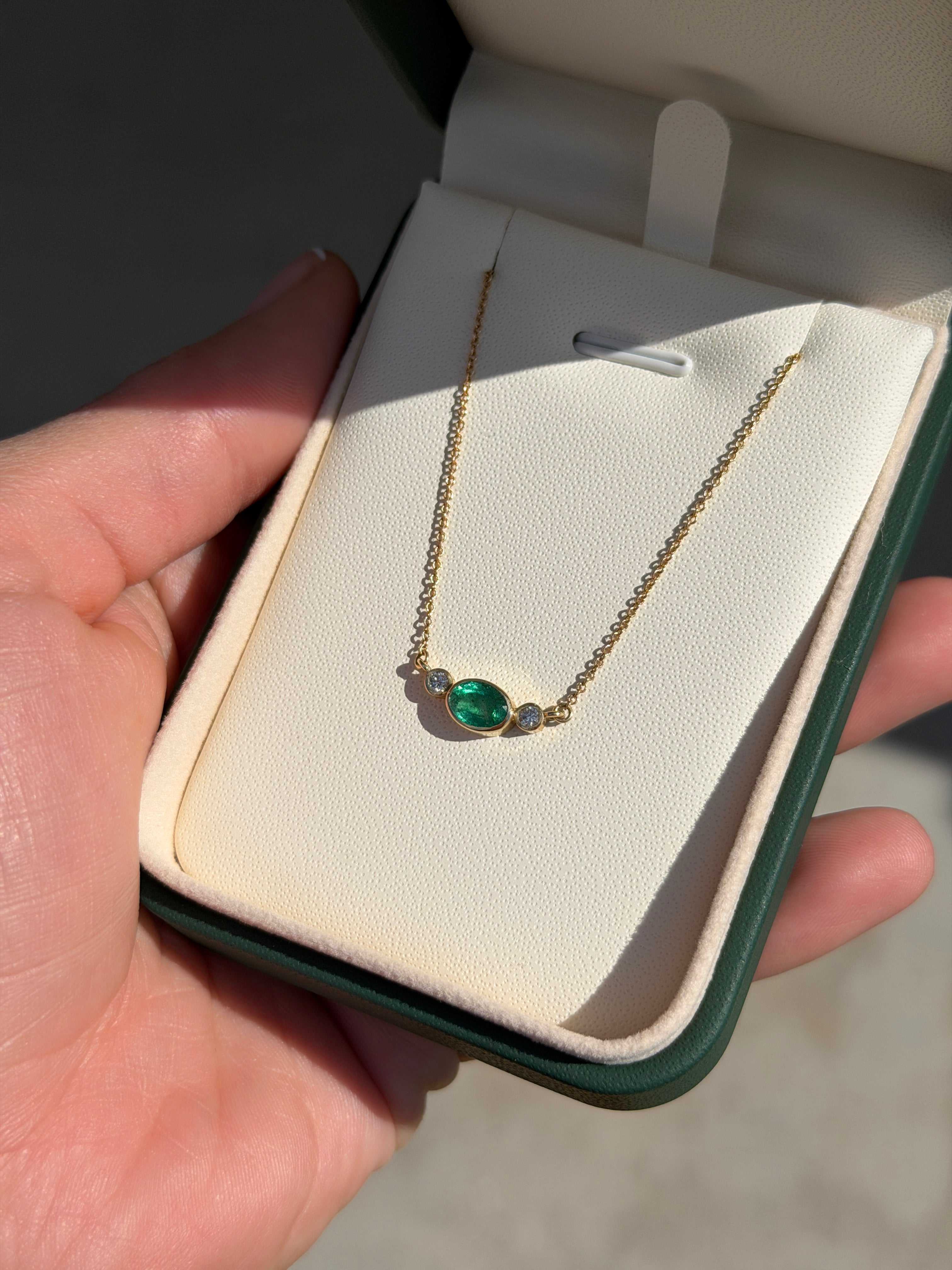 1.0tcw Everyday East-West Oval Emerald & Diamond Bezel Three Stone Necklace 14K