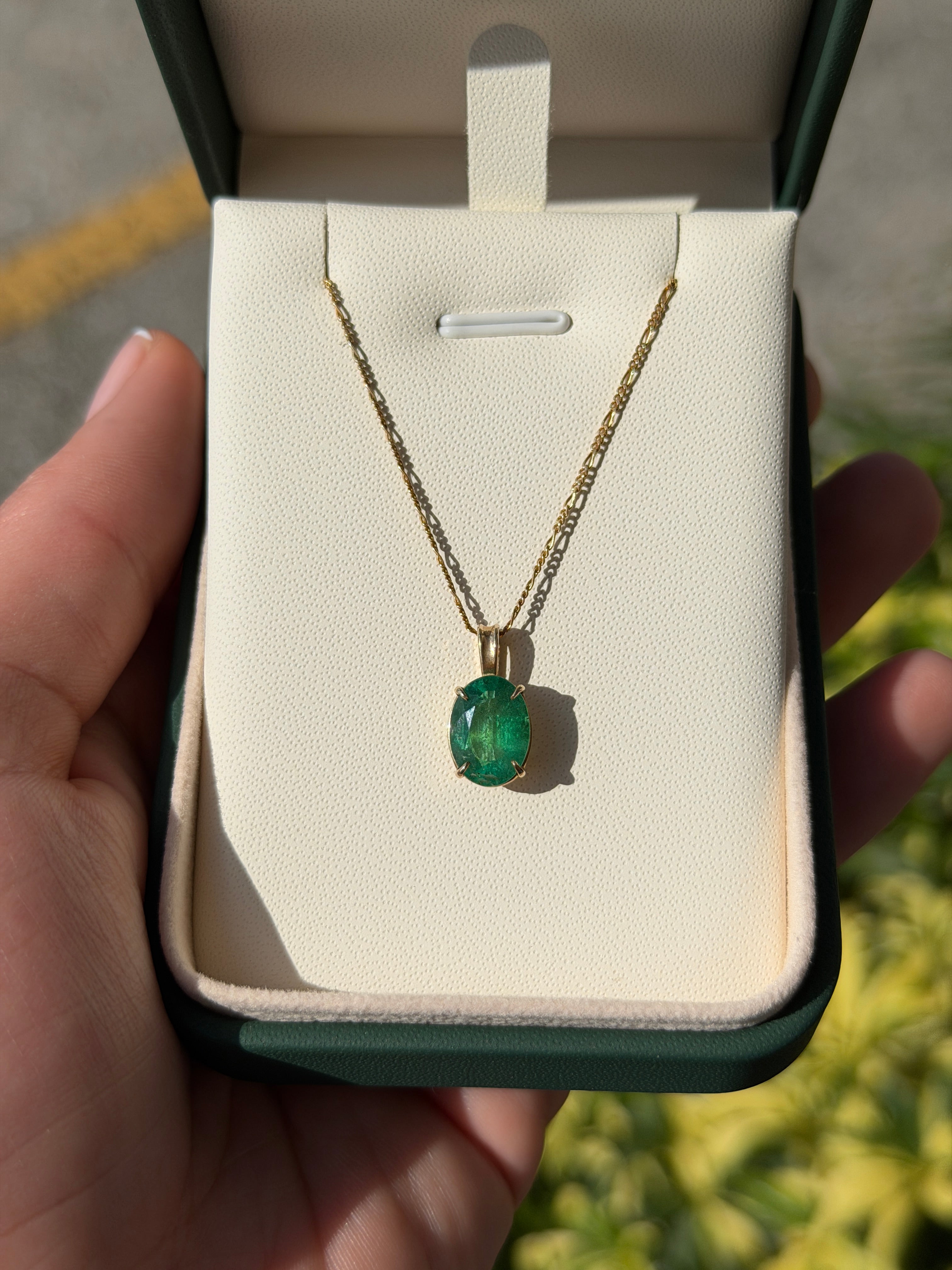 Oval 2.68 carat natural emerald pendant in 14K gold, featuring a solitaire design by JR Colombian Emeralds.