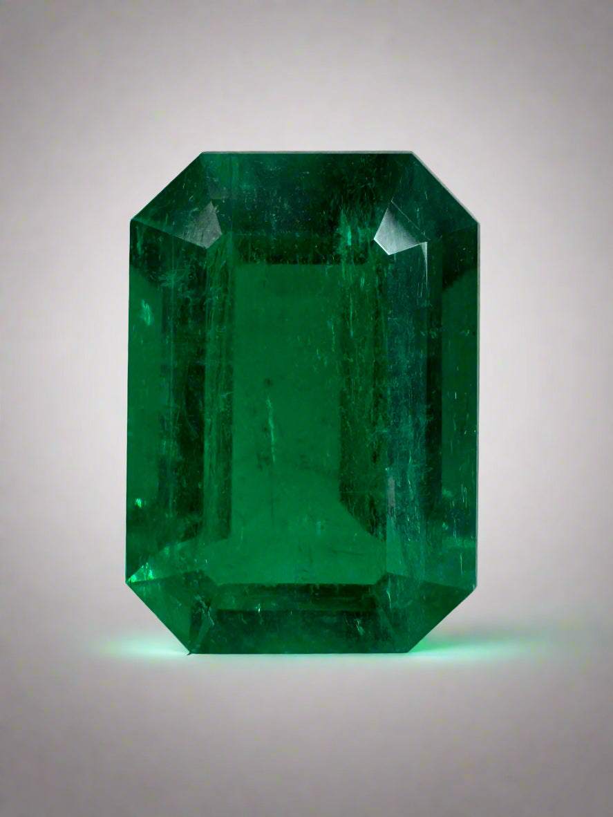 3.95 carat 12x8 mm vivid green emerald cut Colombian emerald with transparent clarity and very good luster
