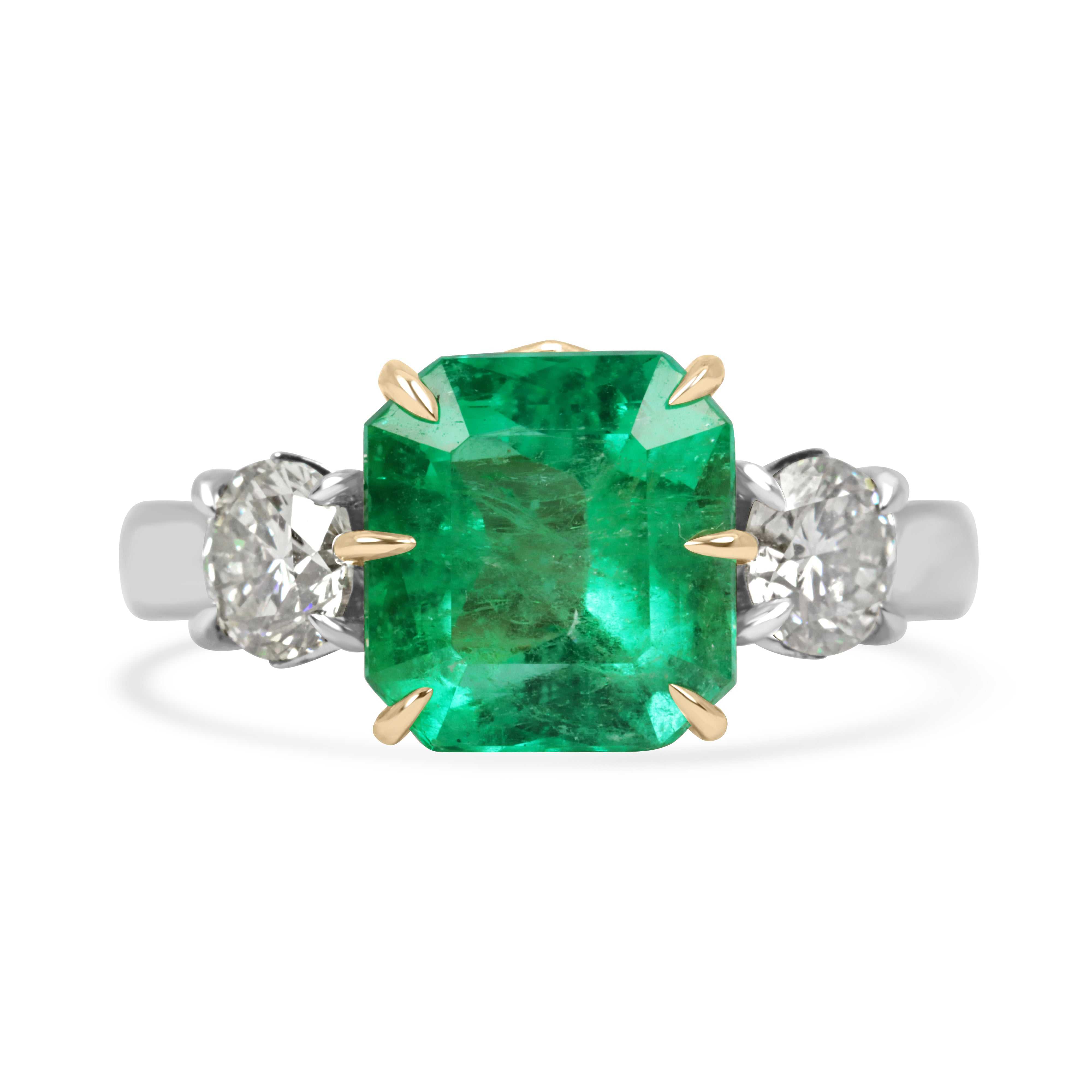5.20tcw 18K two-toned gold ring with 4.20ct Colombian Asscher cut emerald and two brilliant round diamonds