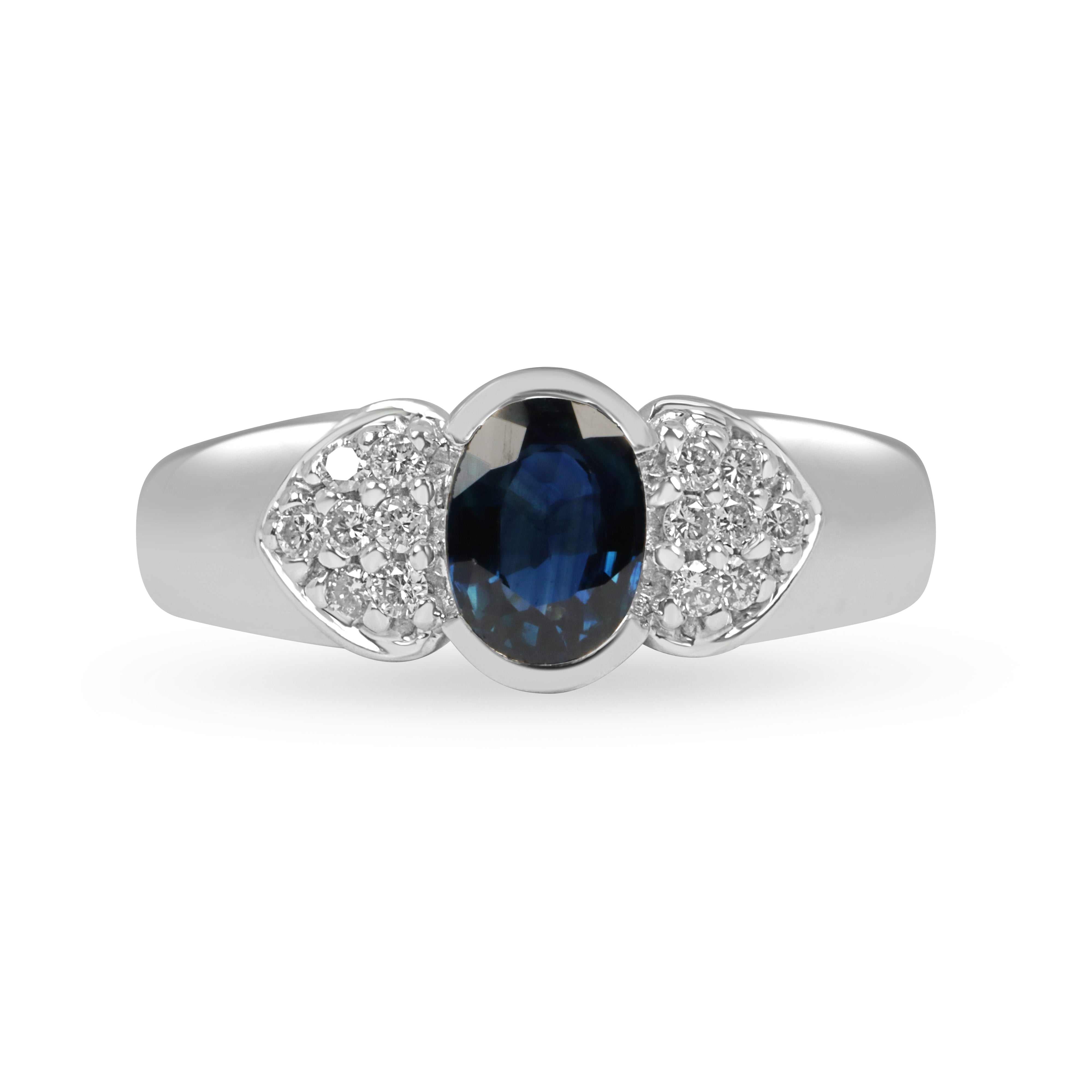 1.21tcw natural sapphire and diamond ring in 14K white gold with oval blue sapphire and pave diamond accents