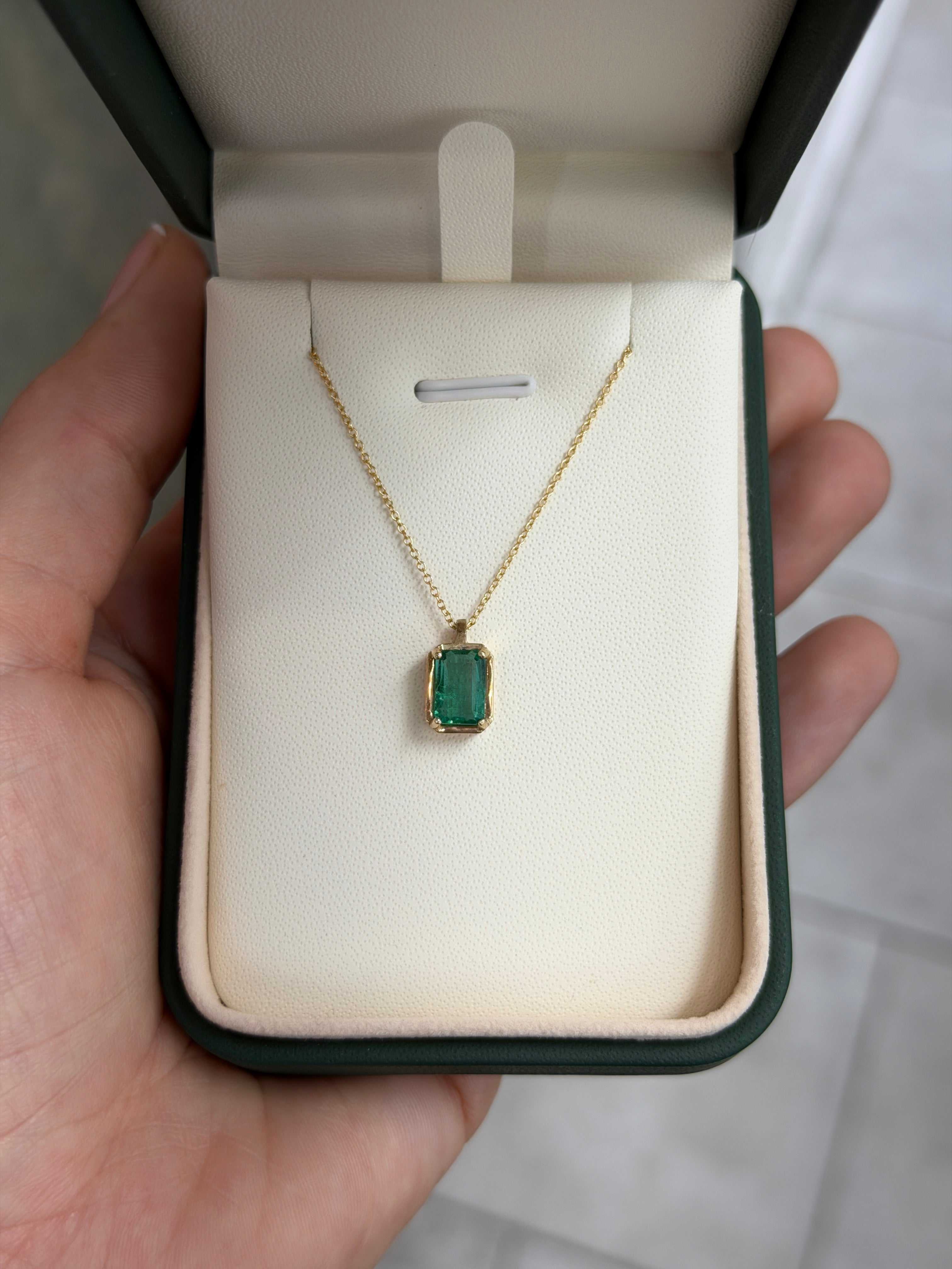 Sterling silver emerald necklace with 1.59 carat bluish green solitaire crystal clear emerald pendant, 14K setting.
