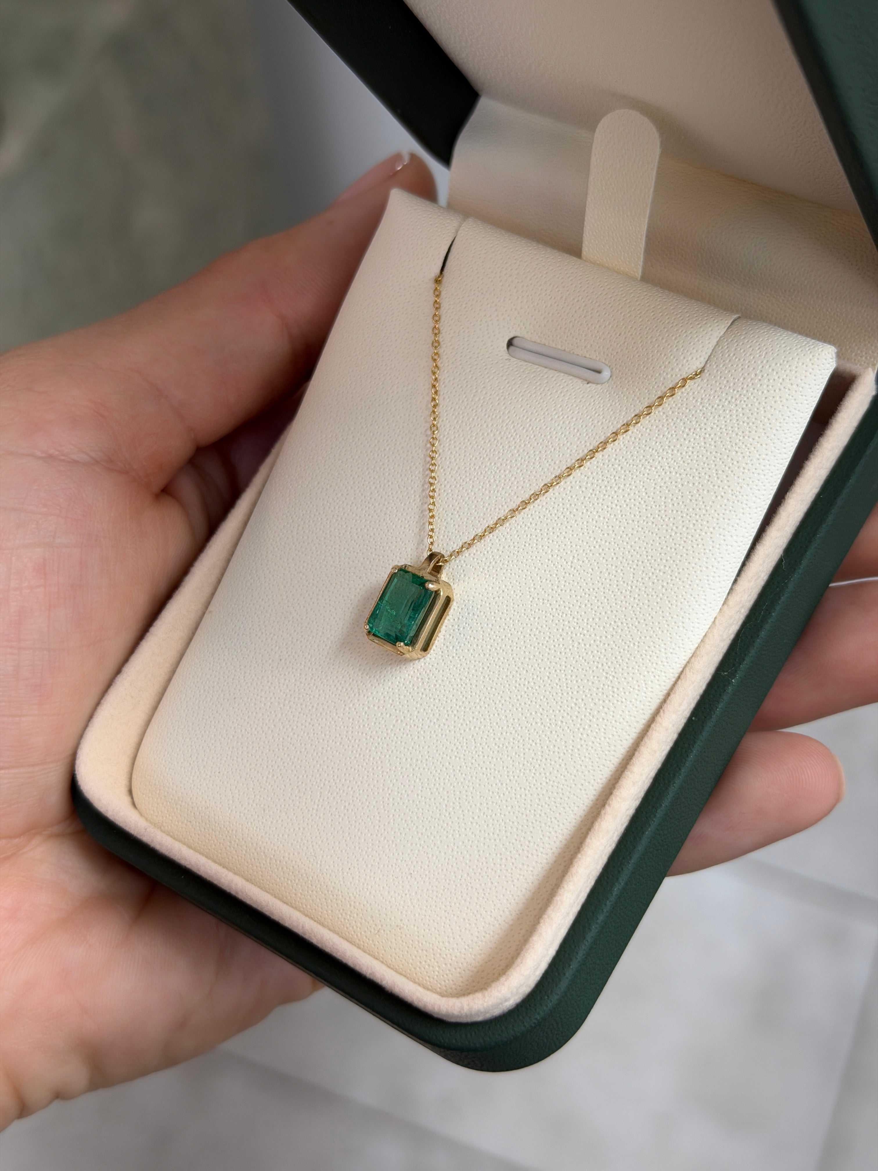 1.59 carat crystal clear bluish green solitaire emerald necklace in 14K gold from JR Colombian Emeralds, featuring a stunning emerald pendant.