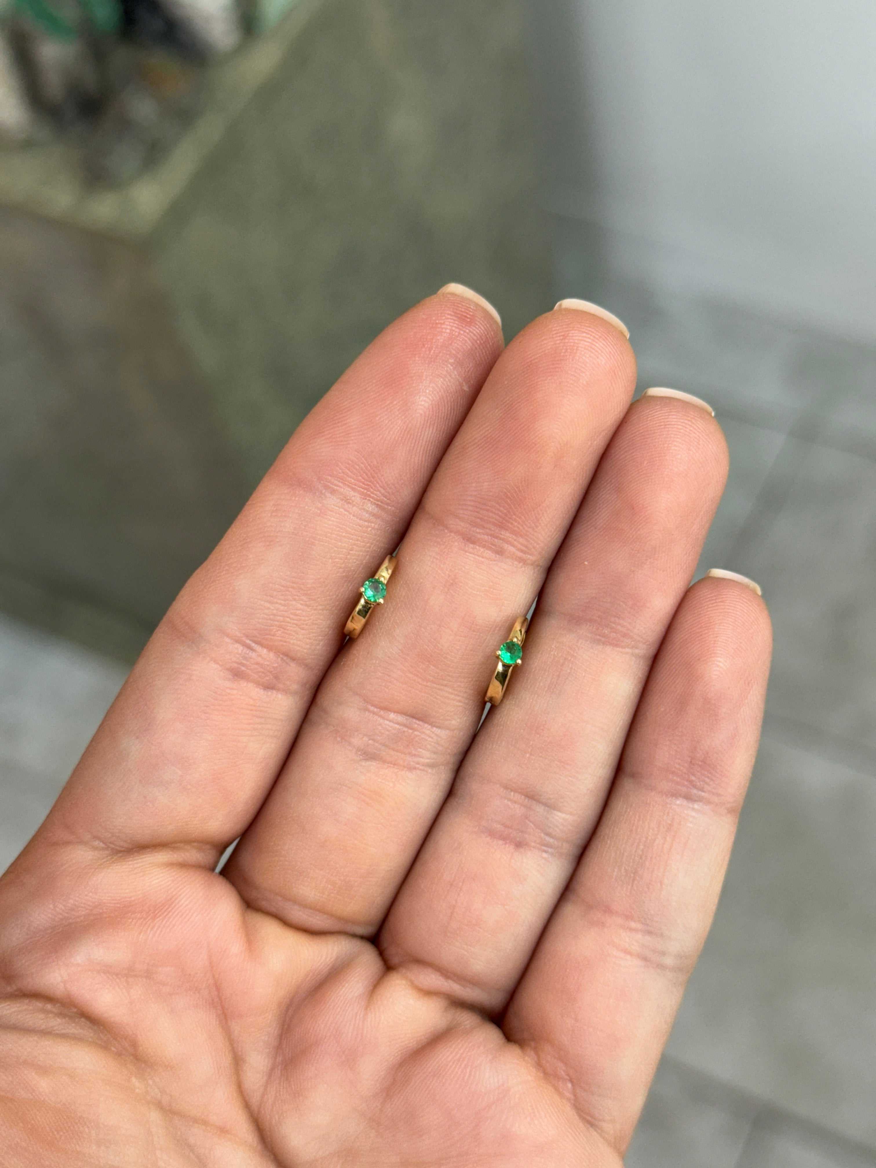 Emerald Huggie Earring in 14K gold with round 0.14-carat Zambian emerald, bezel setting, 9.5mm length, special layaway $200 deposit.