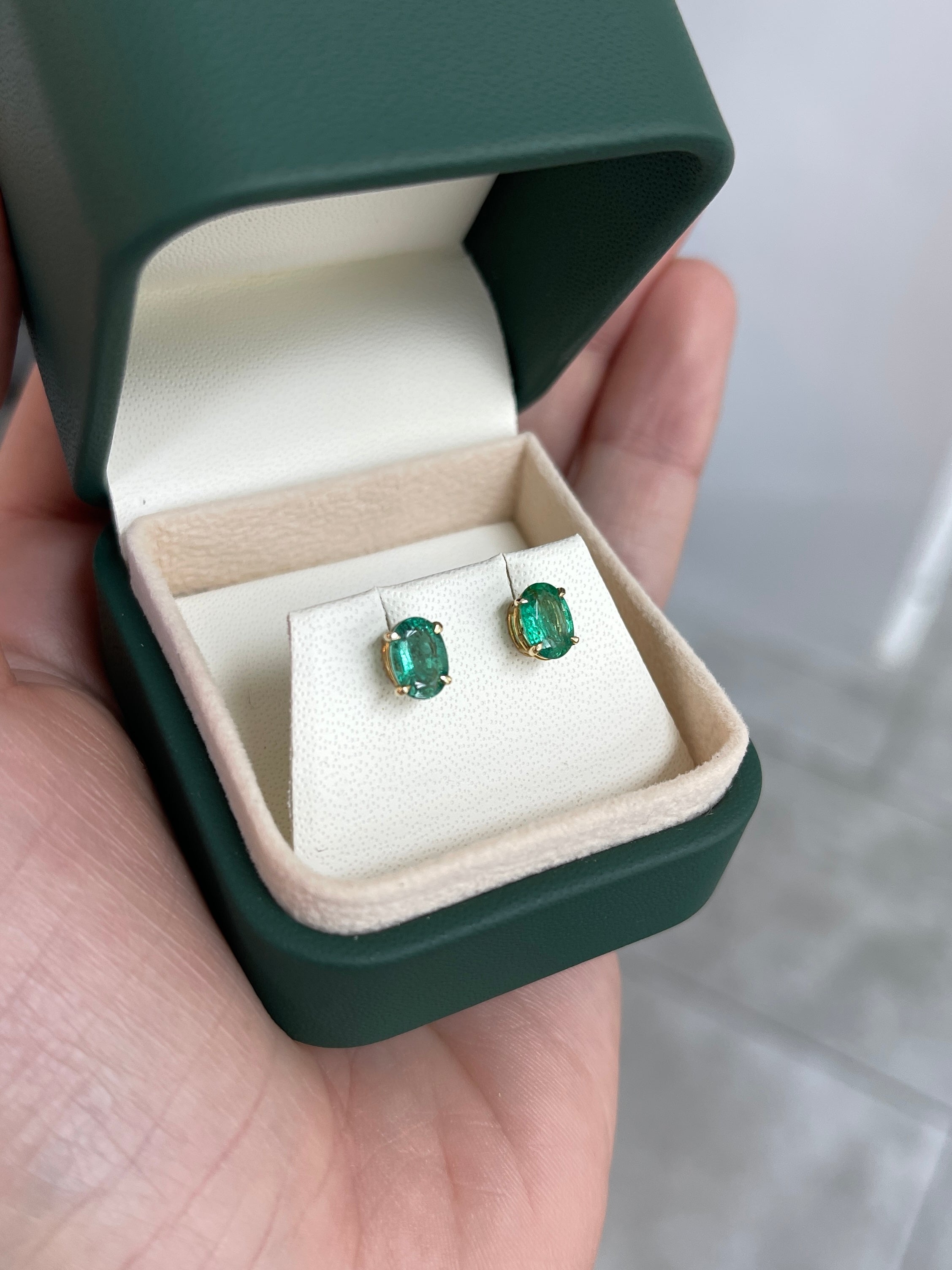 1.60tcw 14K Rich Green Oval Cut Four Prong Emerald Studs Earrings
