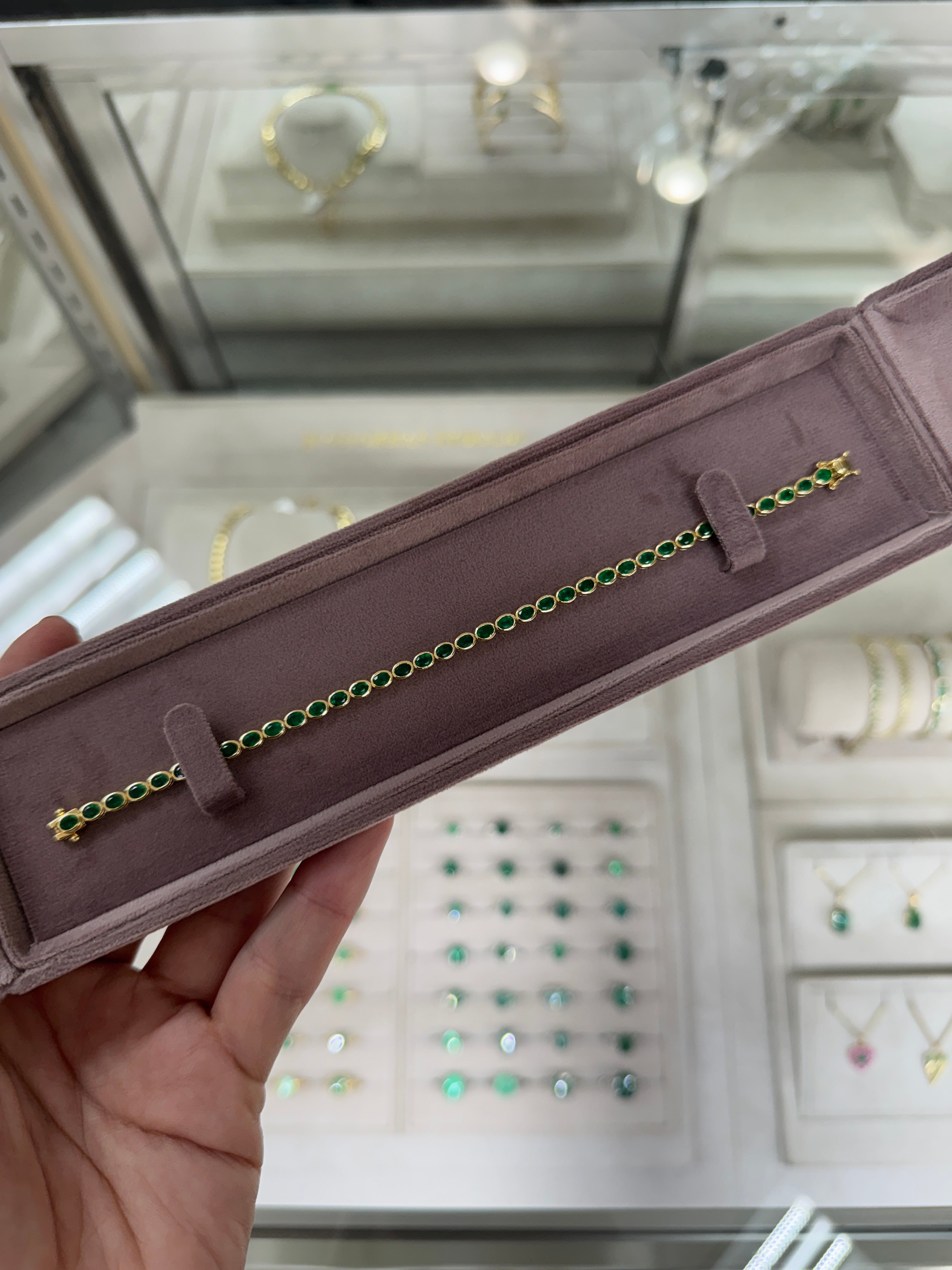 5.74tcw 14K East to West Natural Oval Cut Emerald Bezel Set Tennis Bracelet