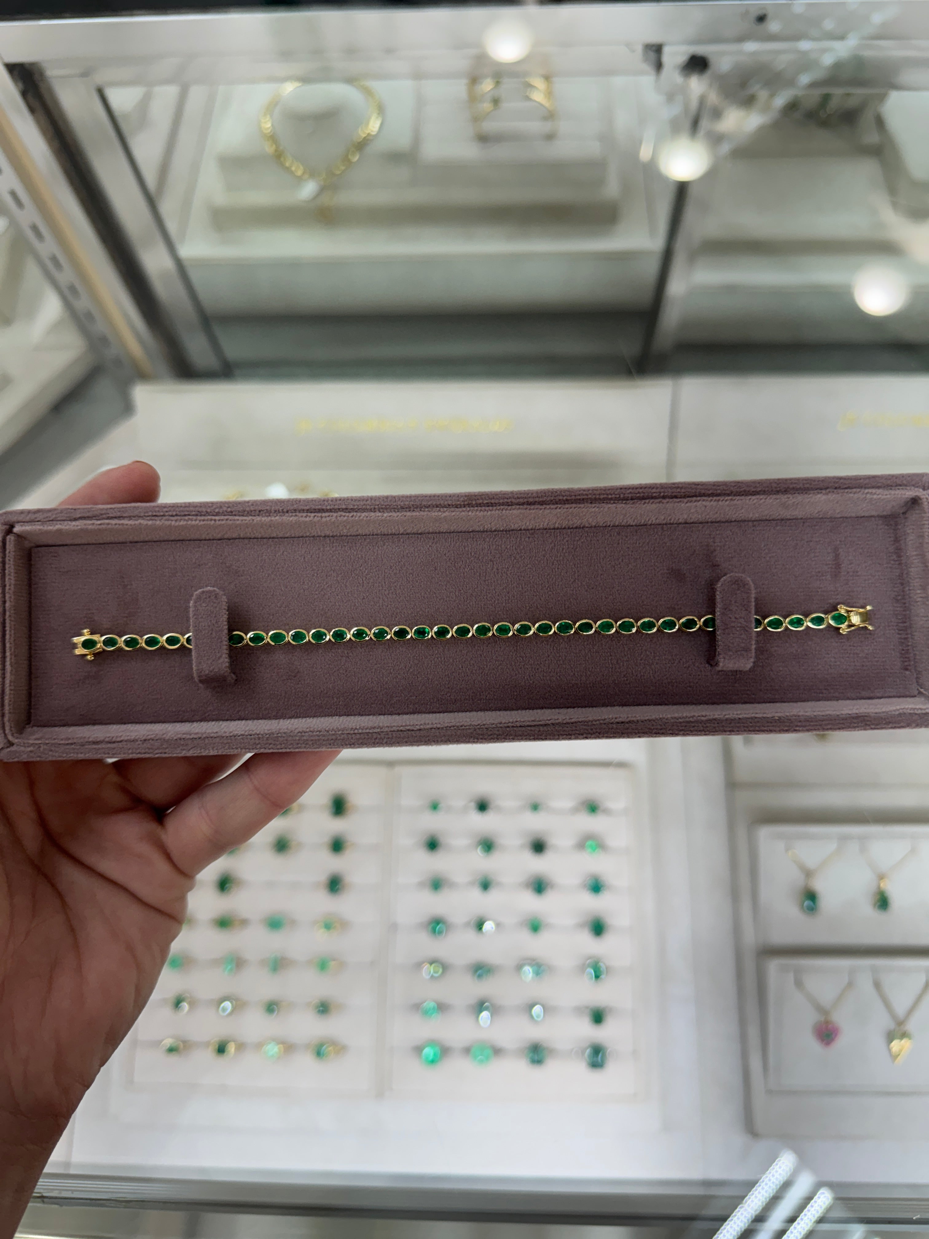 5.74tcw 14K East to West Natural Oval Cut Emerald Bezel Set Tennis Bracelet