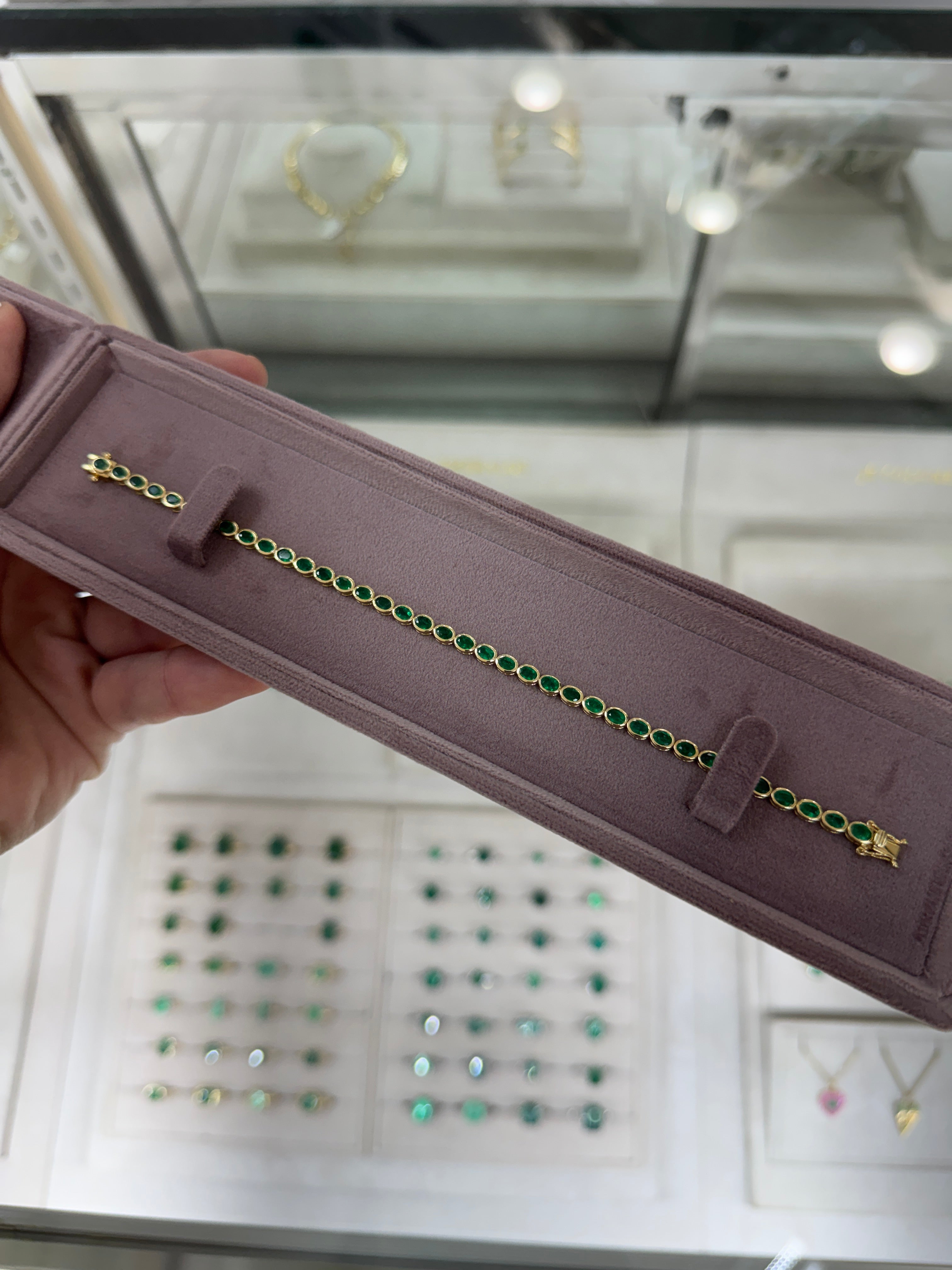 5.74tcw 14K East to West Natural Oval Cut Emerald Bezel Set Tennis Bracelet