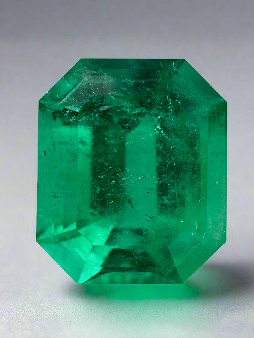 8.40 carat vivid green Colombian emerald cut loose gemstone with excellent luster and natural oiling treatment