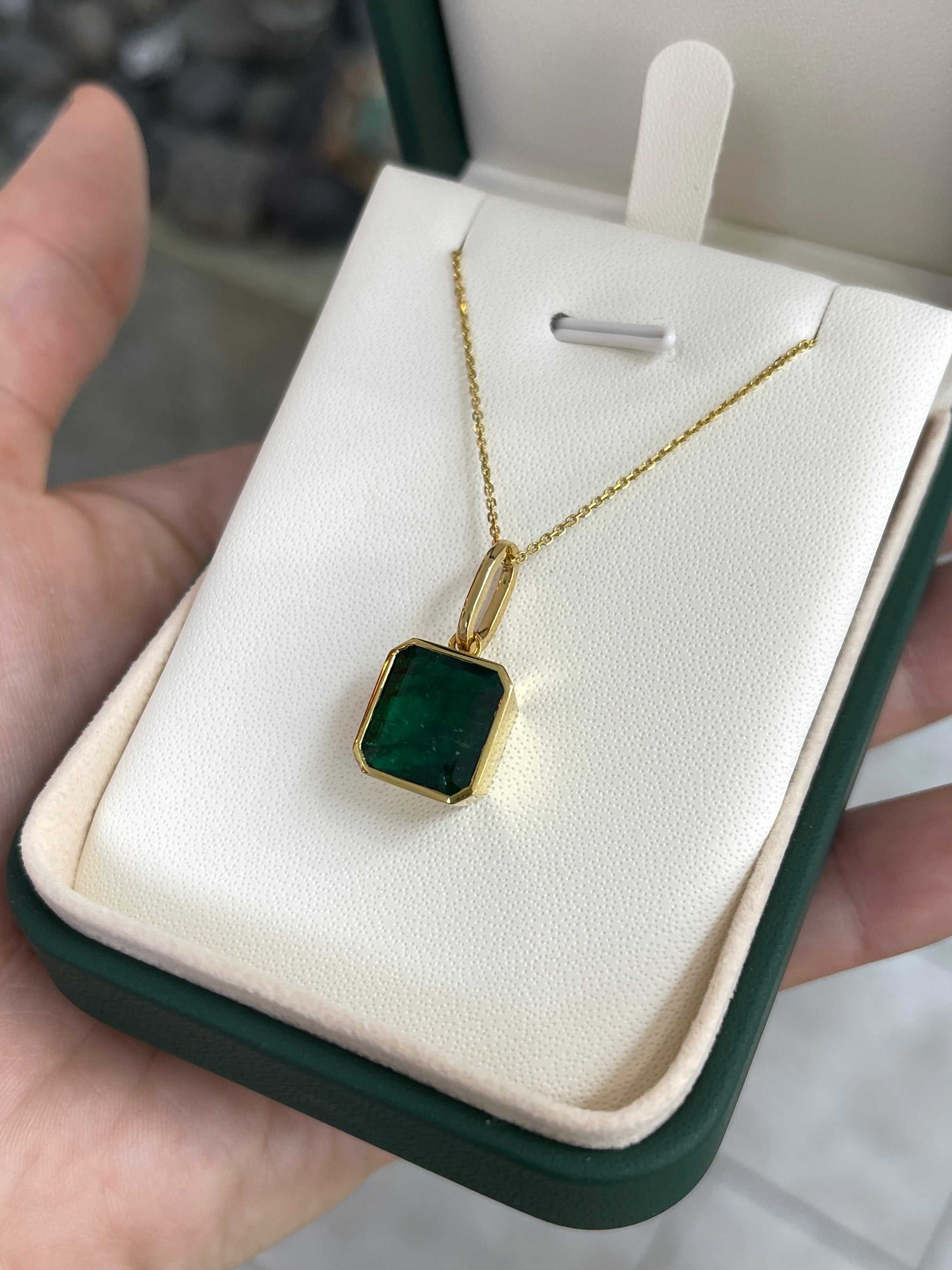 7.79-carat dark green Zambian emerald necklace with bezel setting in 14K gold, featuring a luxurious pendant from JR Colombian Emeralds.