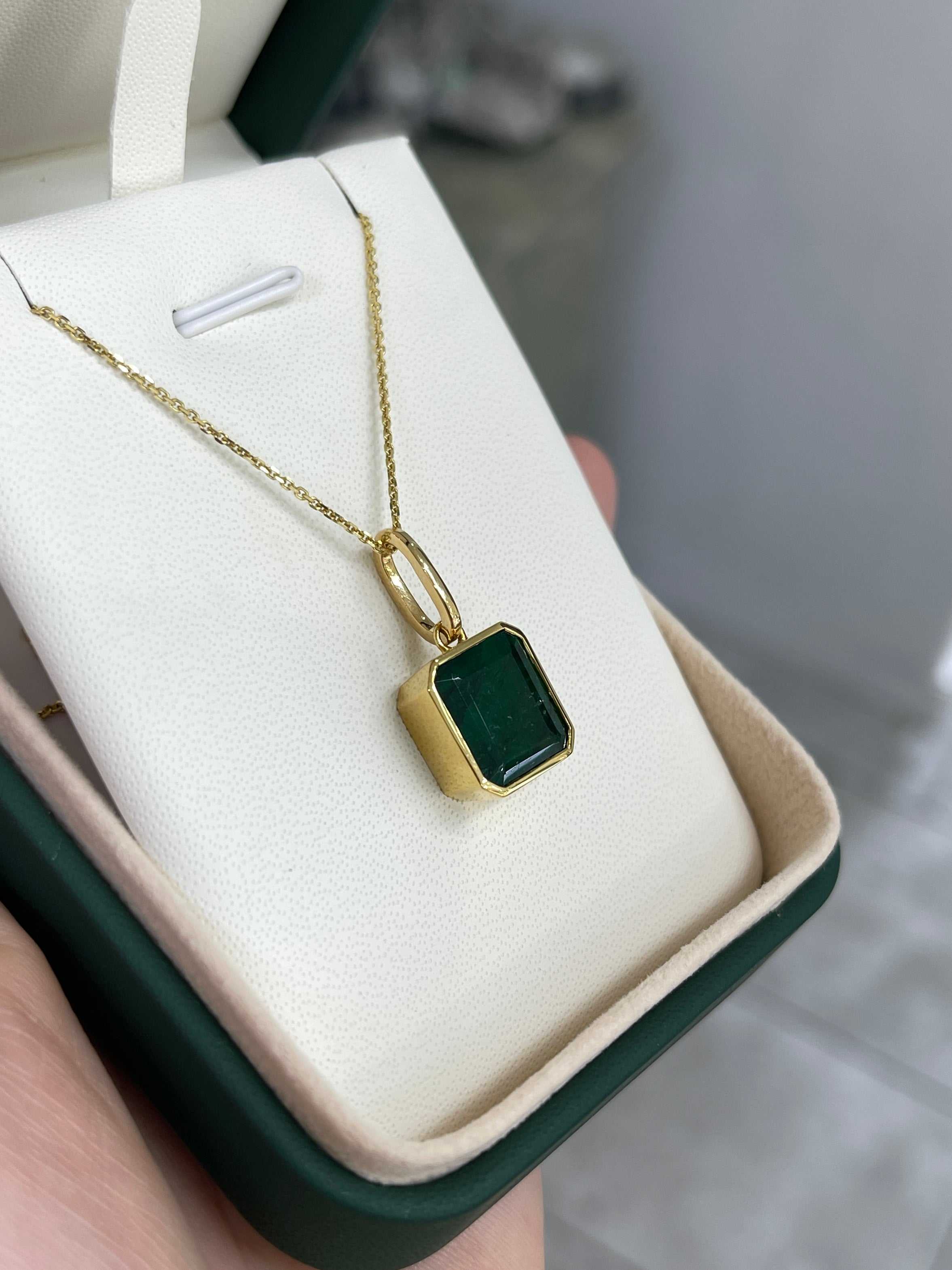 Dark green Zambian emerald necklace with 7.79 carats, bezel set in 14K gold, from JR Colombian Emeralds.