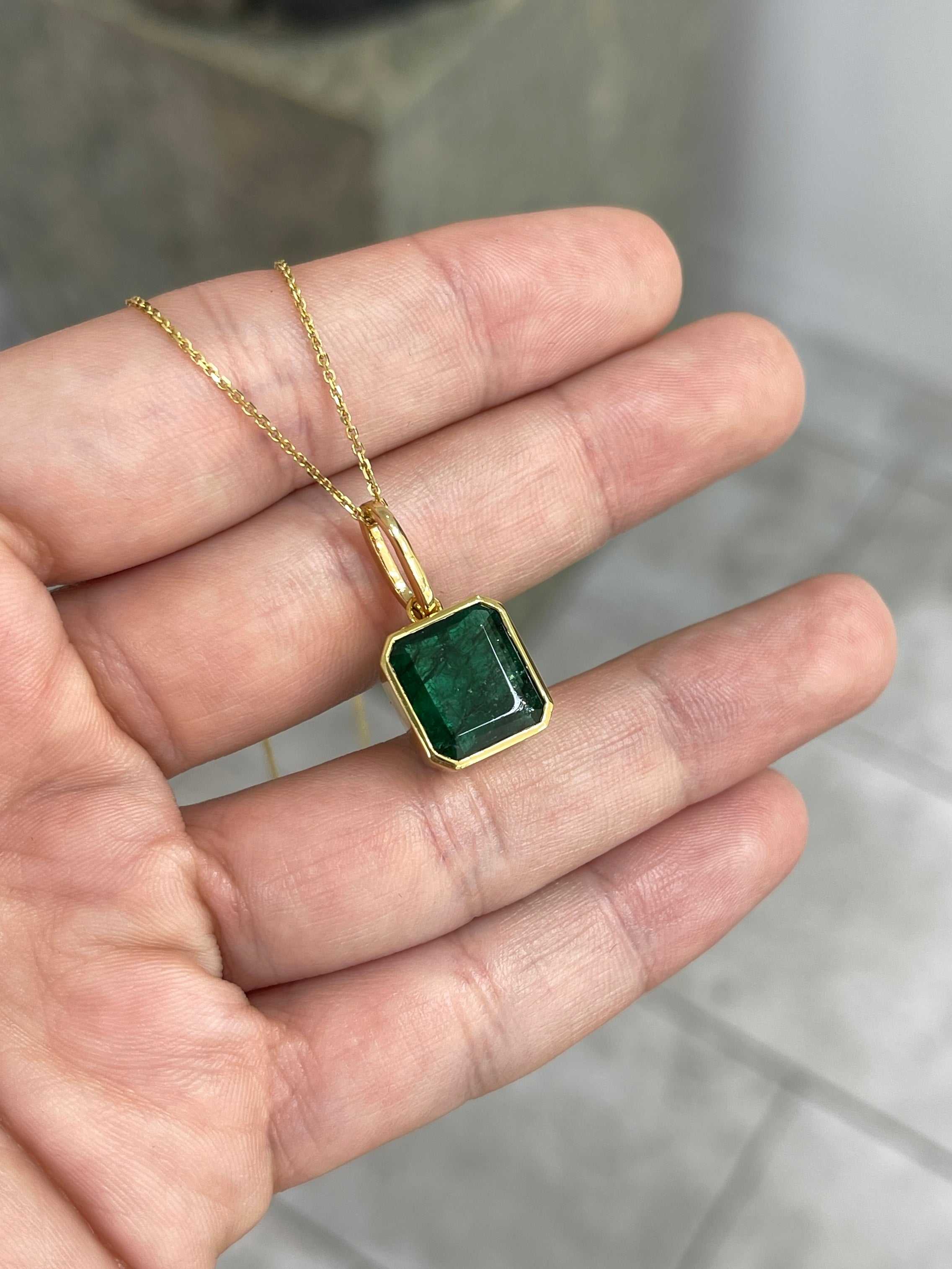 Dark green Zambian emerald necklace with 7.79 carat bezel set emerald in 14K gold by JR Colombian Emeralds.