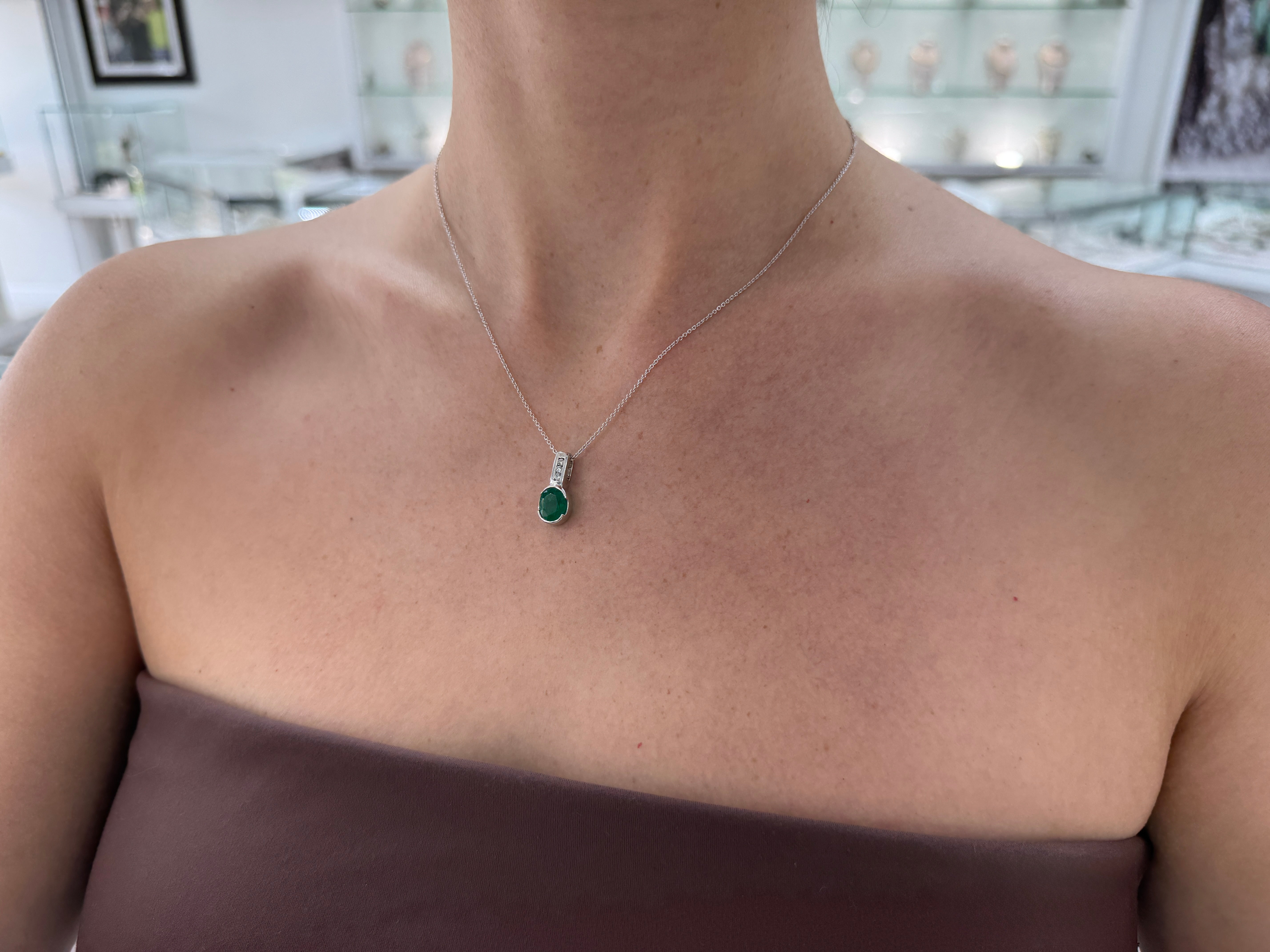 2.25tcw 14K Rich Oval Cut Emerald Half Bezel Set & Diamond Bale Accents