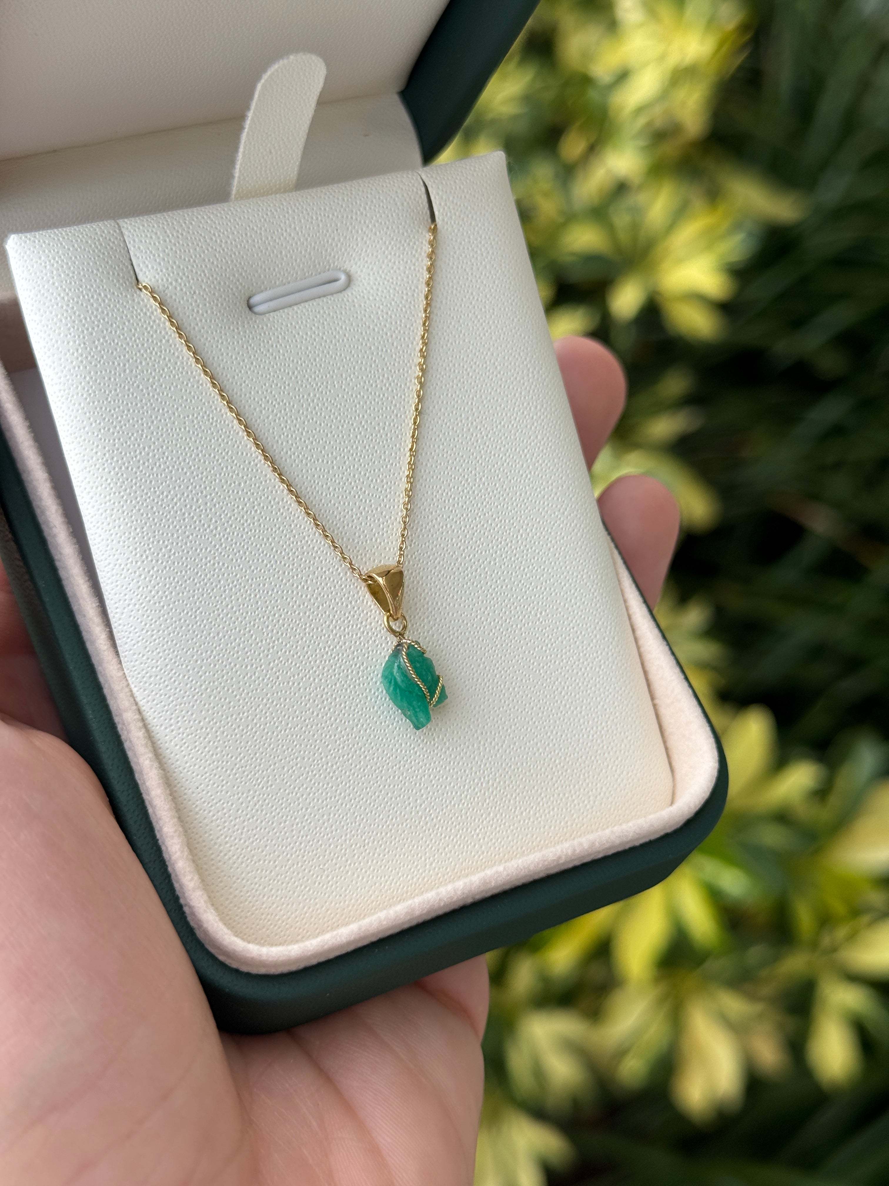 18K gold necklace featuring a 1.40 carat Chinese New Year horse-shaped Colombian emerald pendant by JR Colombian Emeralds.