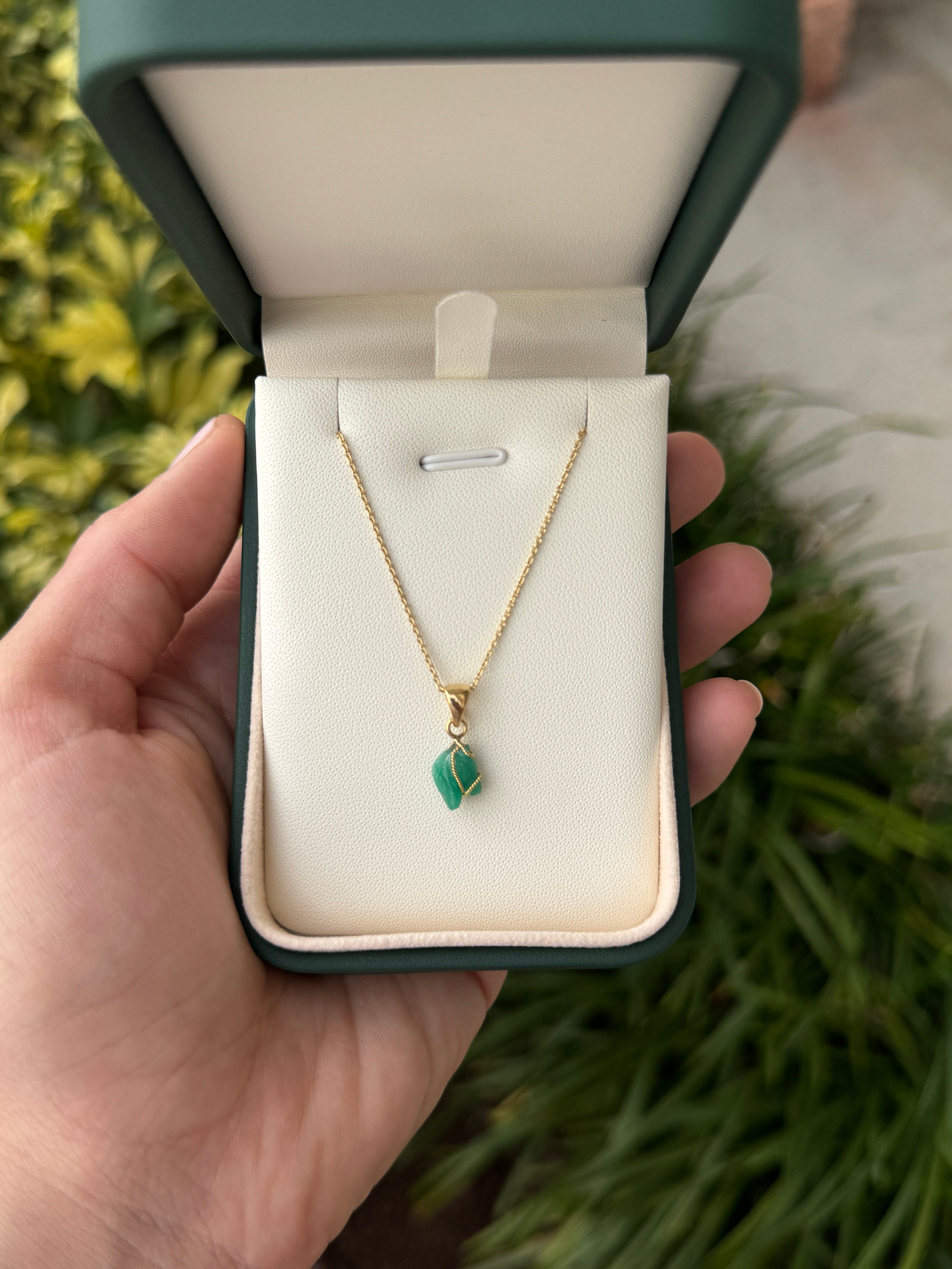 18K gold necklace featuring a 1.40 carat Chinese New Year horse-shaped Colombian emerald pendant by JR Colombian Emeralds