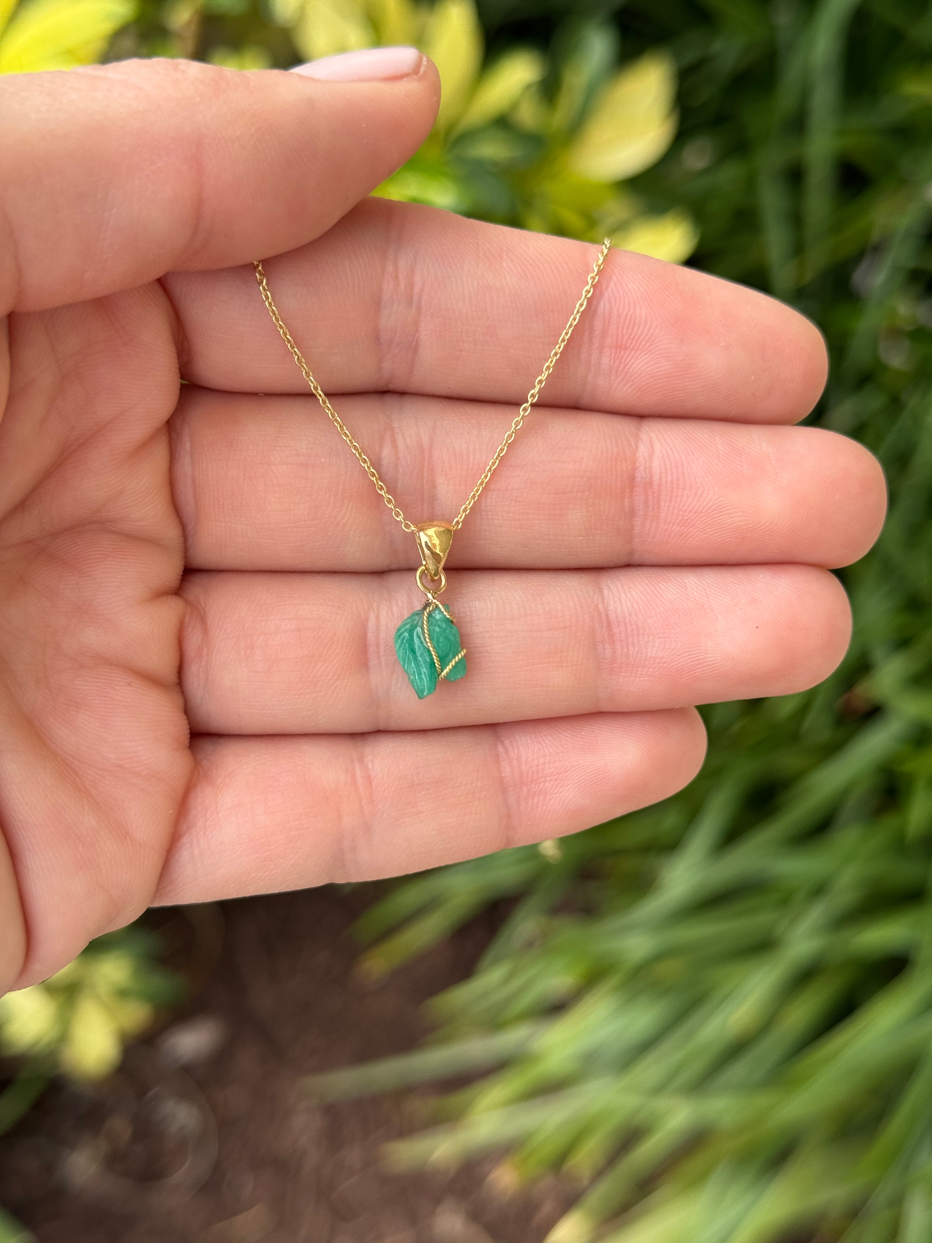 1.40 carat Chinese New Year horse-shaped necklace featuring Colombian emeralds on an 18K gold chain by JR Colombian Emeralds.