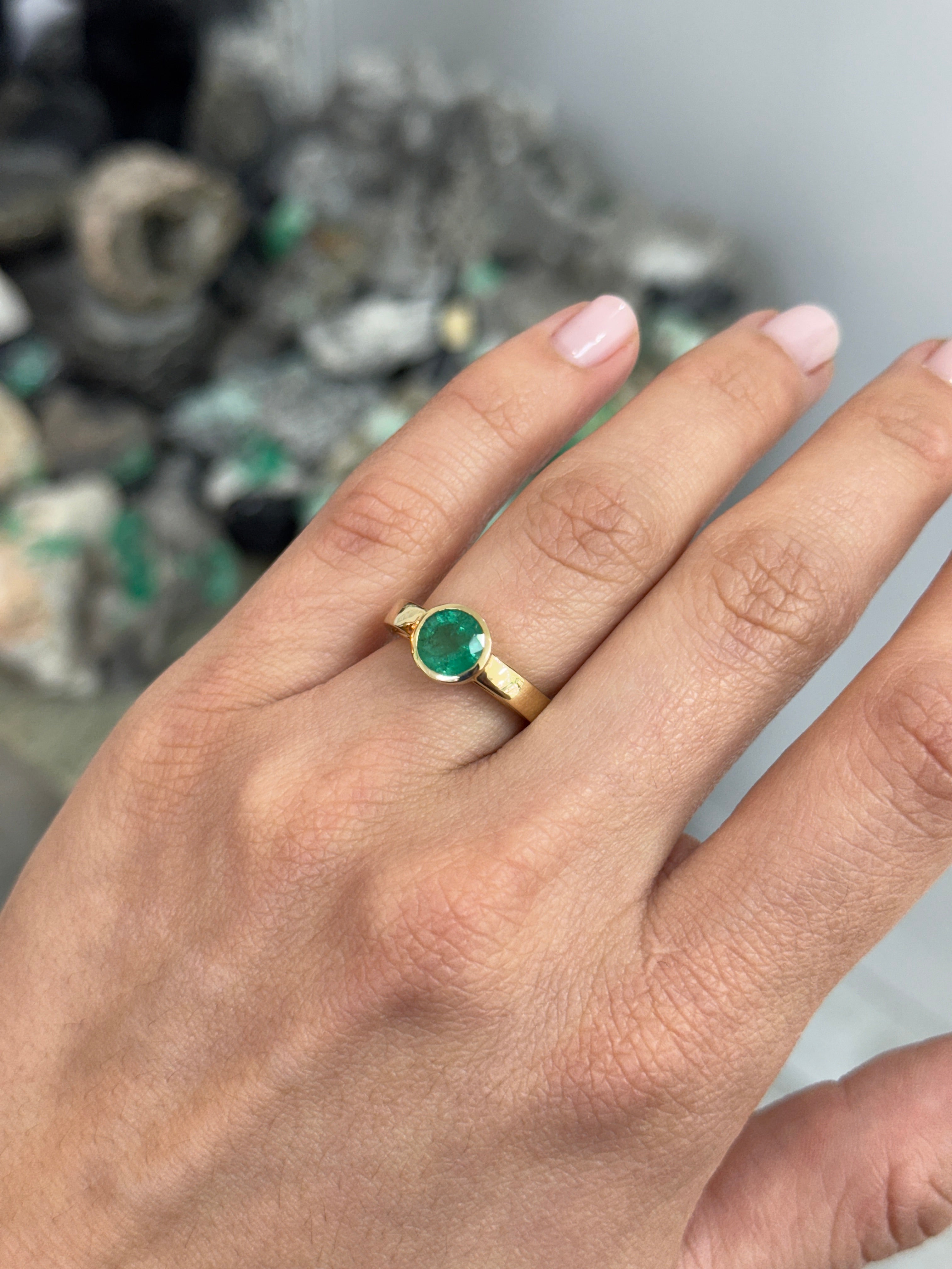 14K gold bezel set round emerald solitaire ring featuring a 1.73 carat emerald by JR Colombian Emeralds.