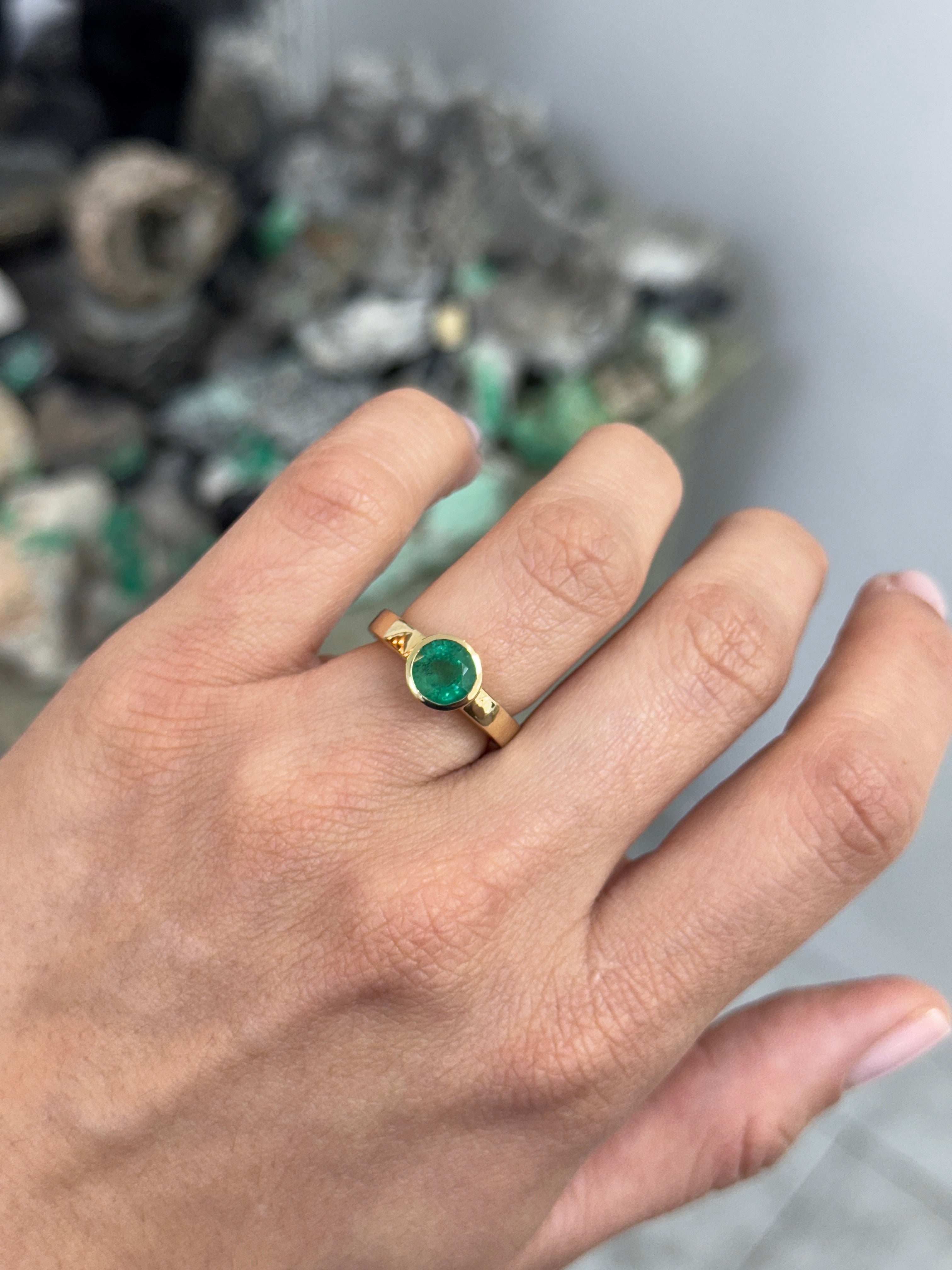 14K gold bezel set round emerald solitaire ring featuring a 1.73 carat emerald by JR Colombian Emeralds.