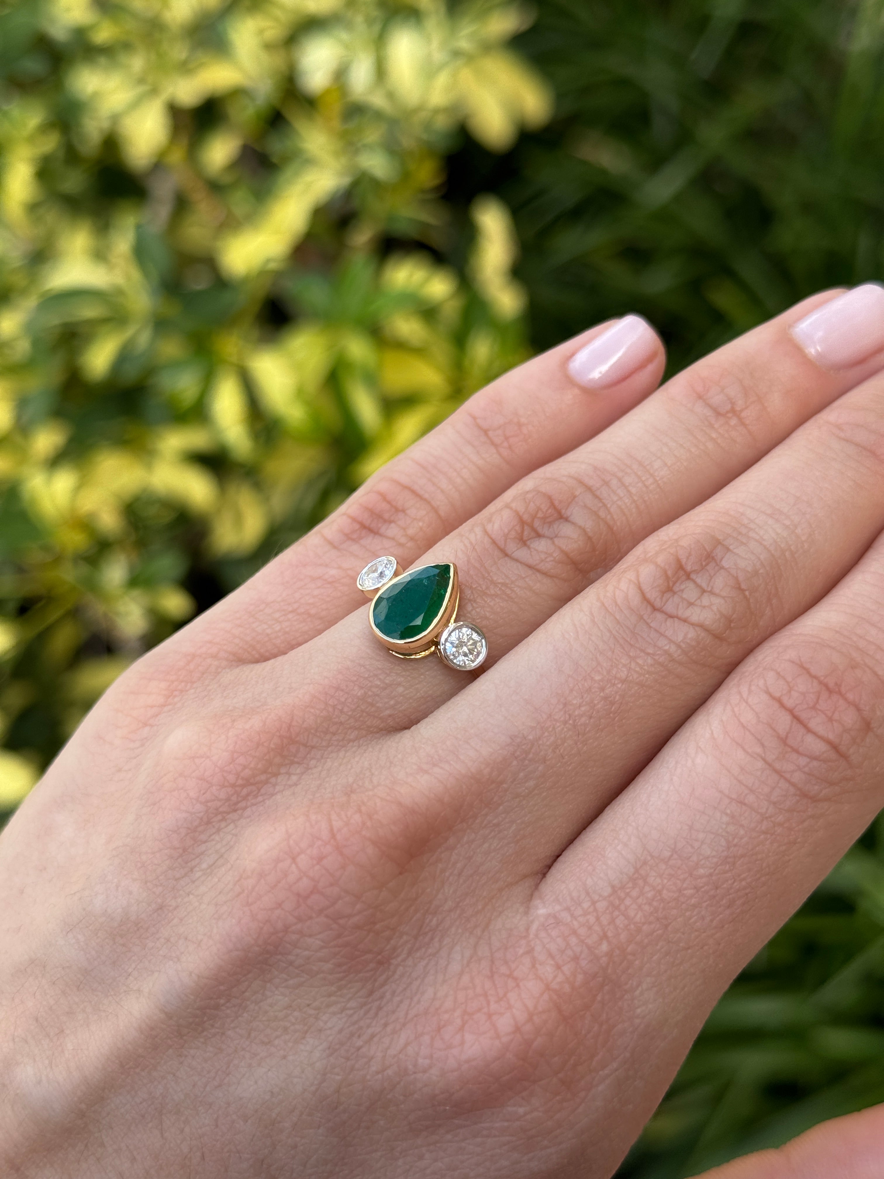 14K yellow gold three-stone pear emerald ring with round diamond accents, 2.91 carats, by JR Colombian Emeralds.