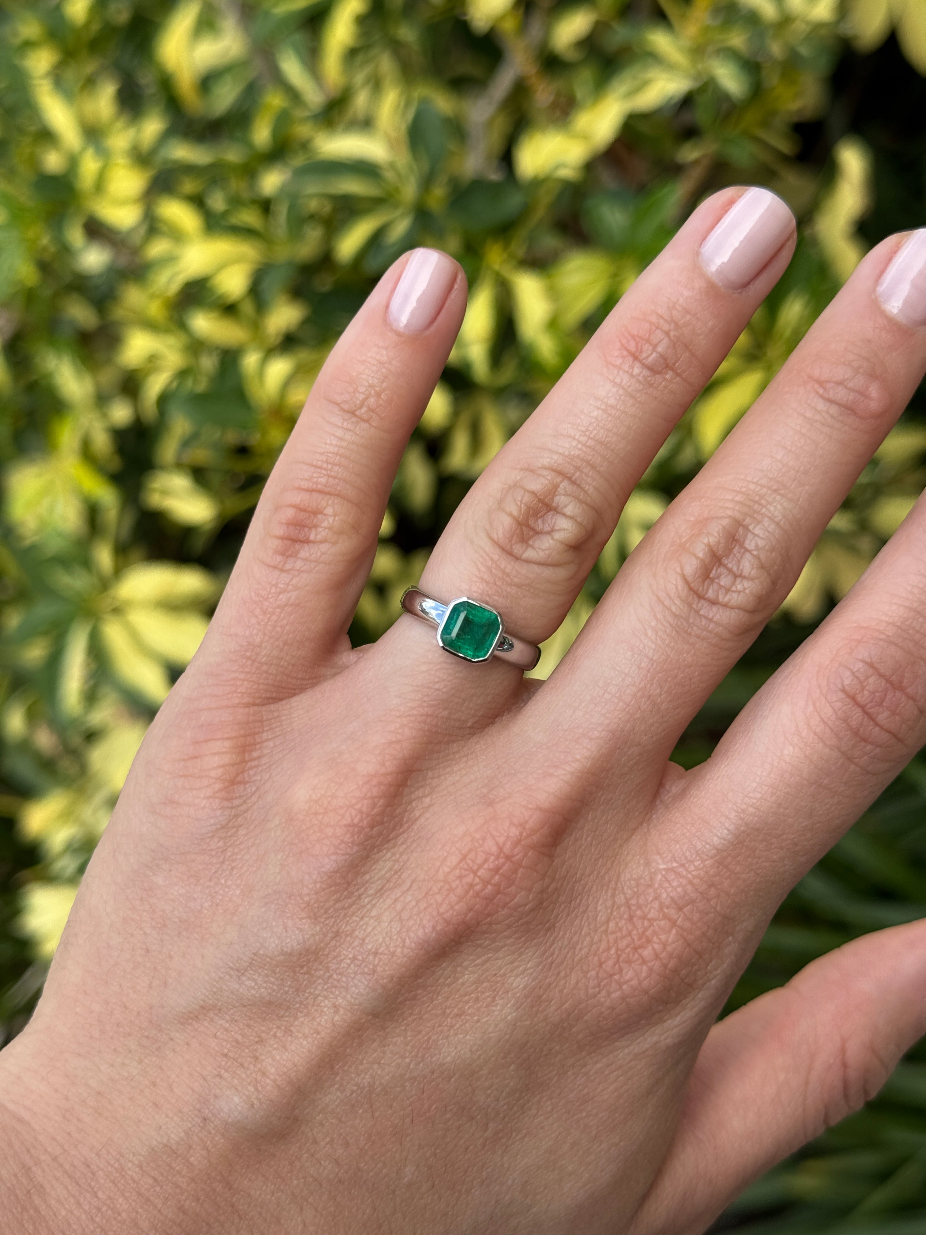 Asscher cut 1.32 carat emerald diamond in bezel setting on white gold solitaire ring from JR Colombian Emeralds.