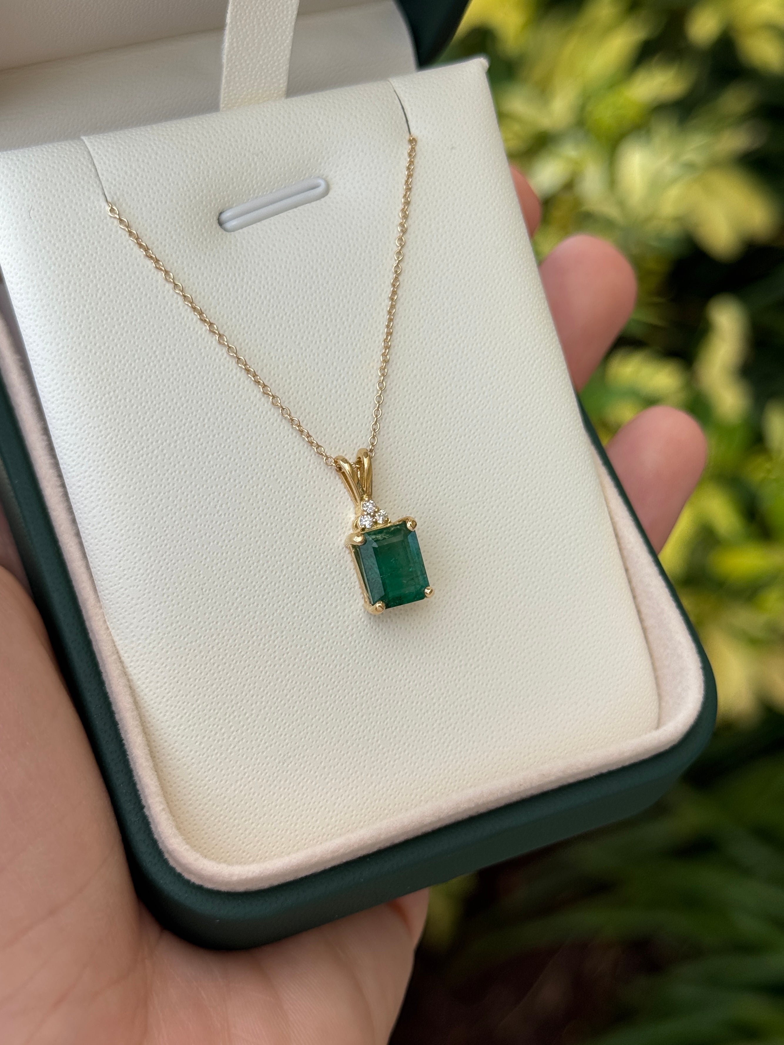 Emerald cut emerald pendant with trefoil diamond accents in 14K gold, featuring 2.75 carats from JR Colombian Emeralds.