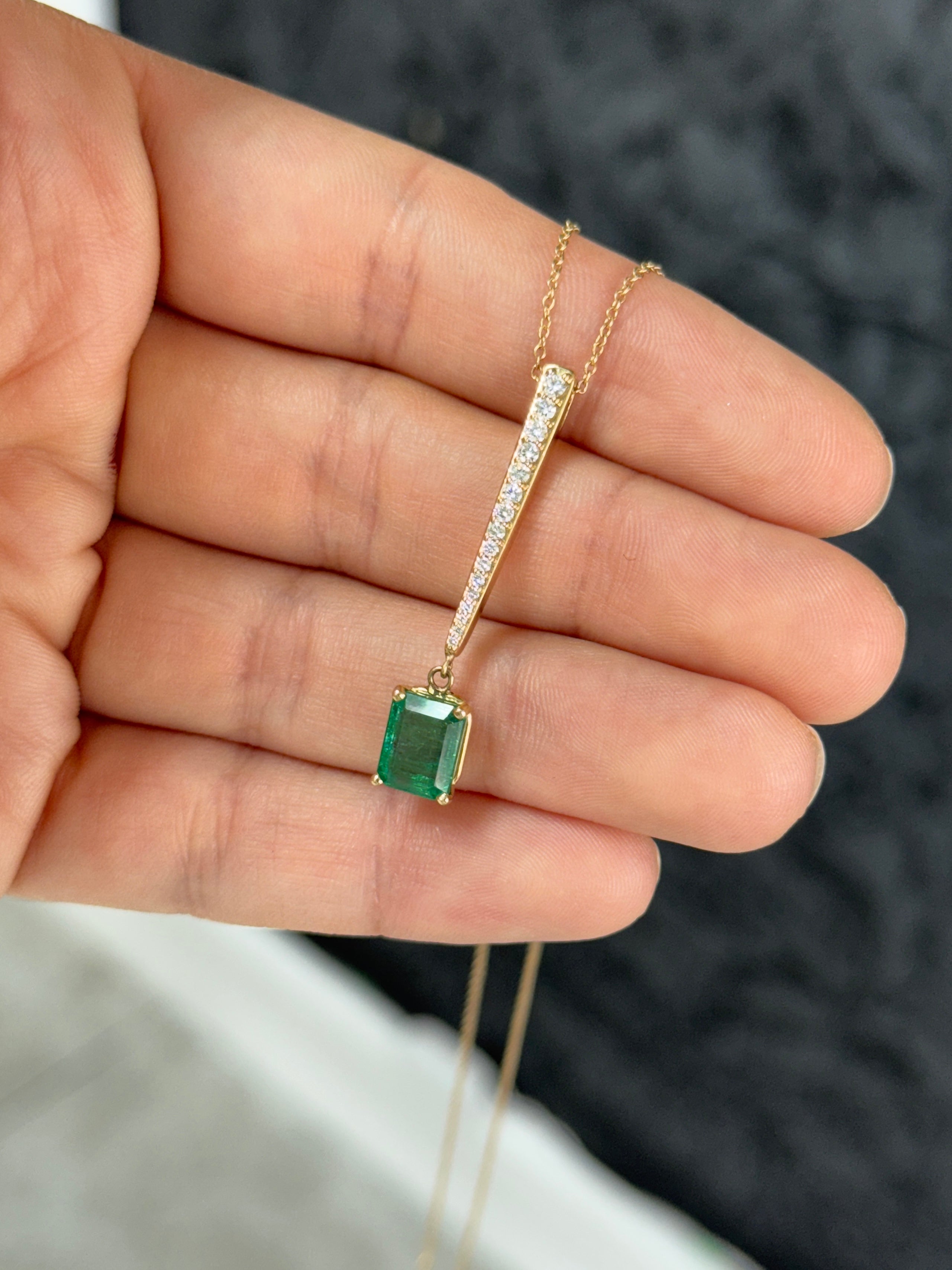 14K natural emerald cut emerald and diamond V-drop pendant necklace with diamond accents, featuring a JR Colombian Emeralds design.
