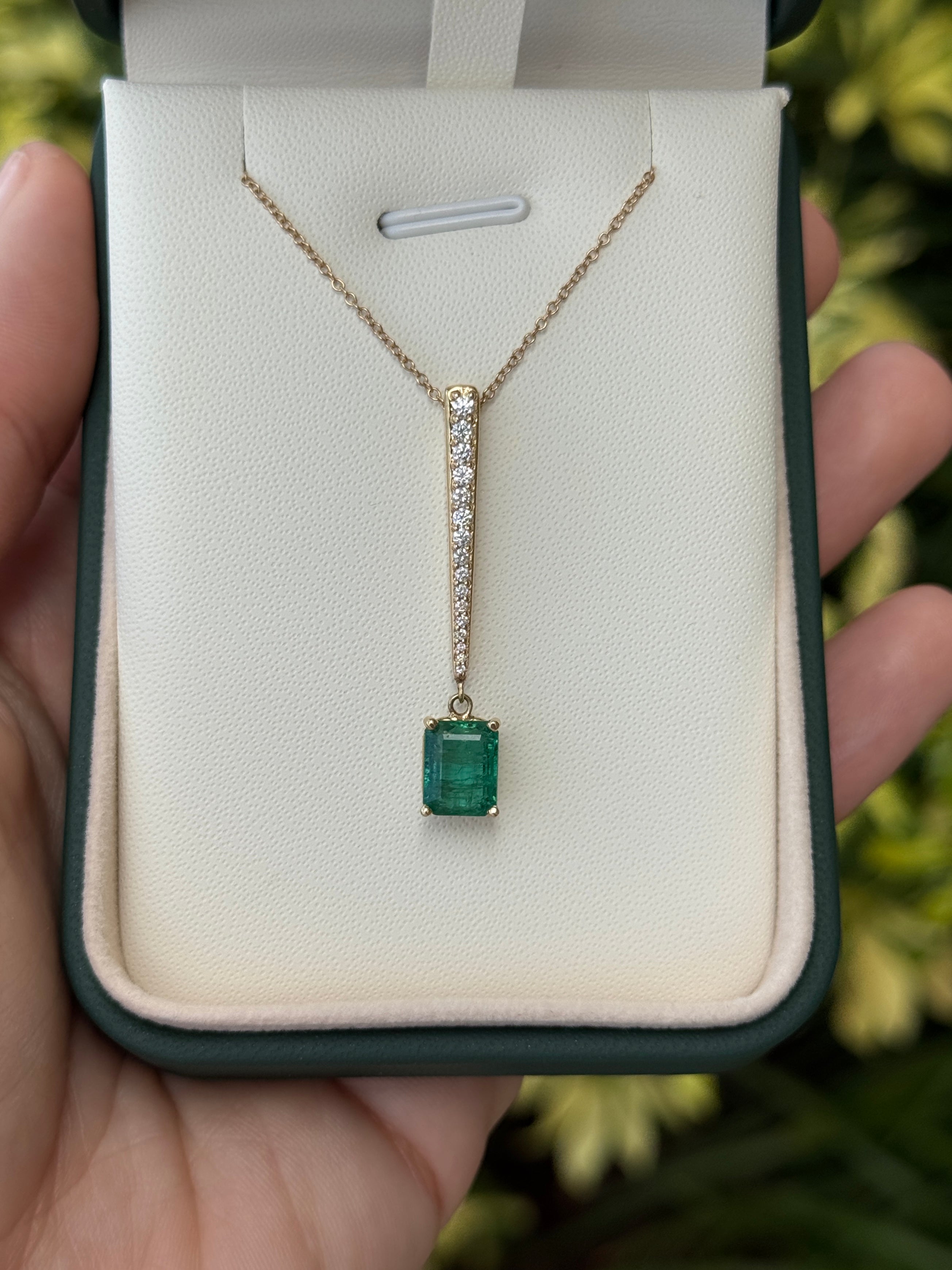 14K gold emerald cut emerald and diamond V-drop pendant necklace with diamond accents, featuring a 2.68 tcw gemstone from JR Colombian Emeralds.