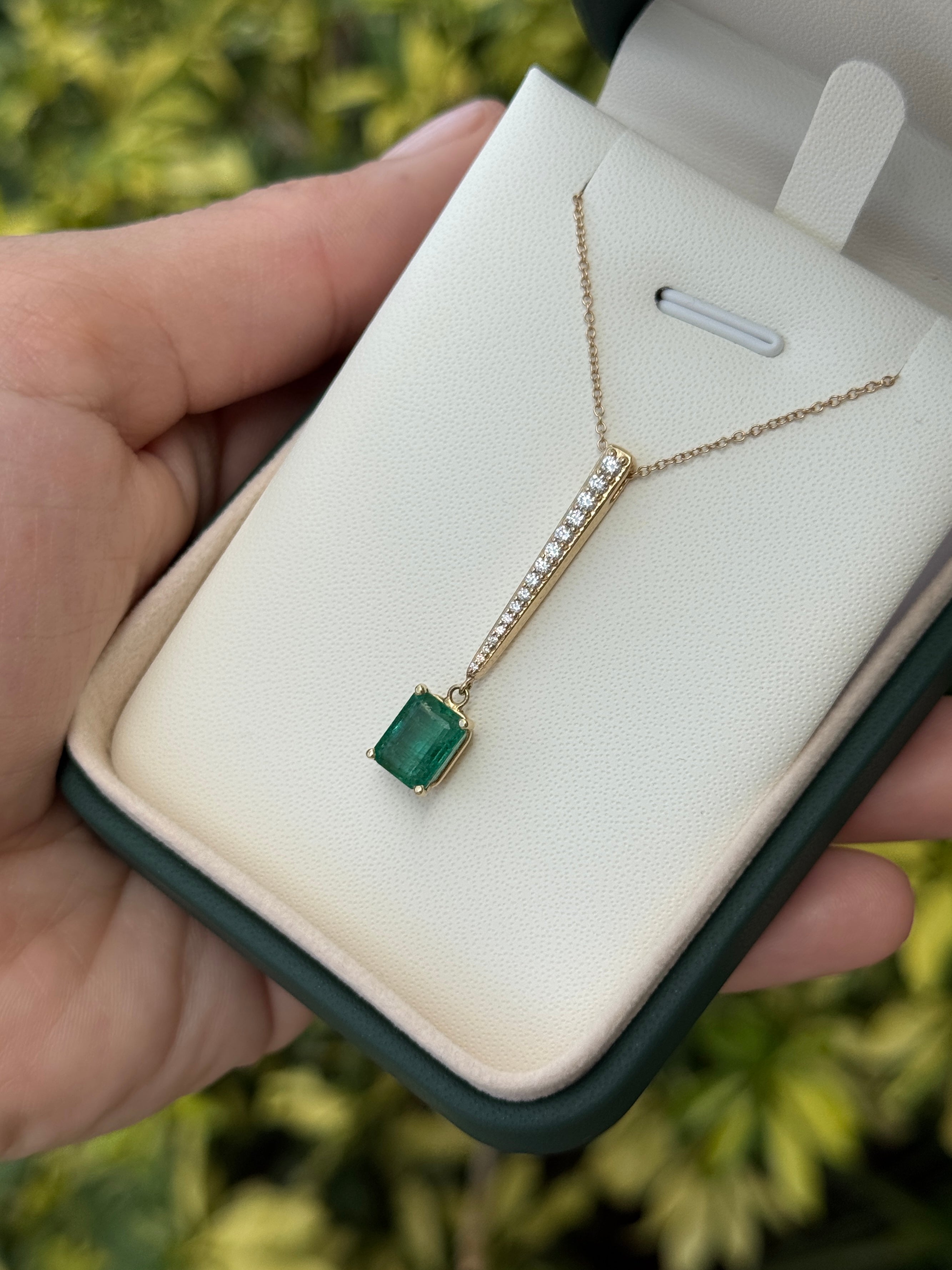 14K natural emerald cut emerald and diamond V-drop pendant necklace with diamond accents, featuring 2.68tcw from JR Colombian Emeralds.