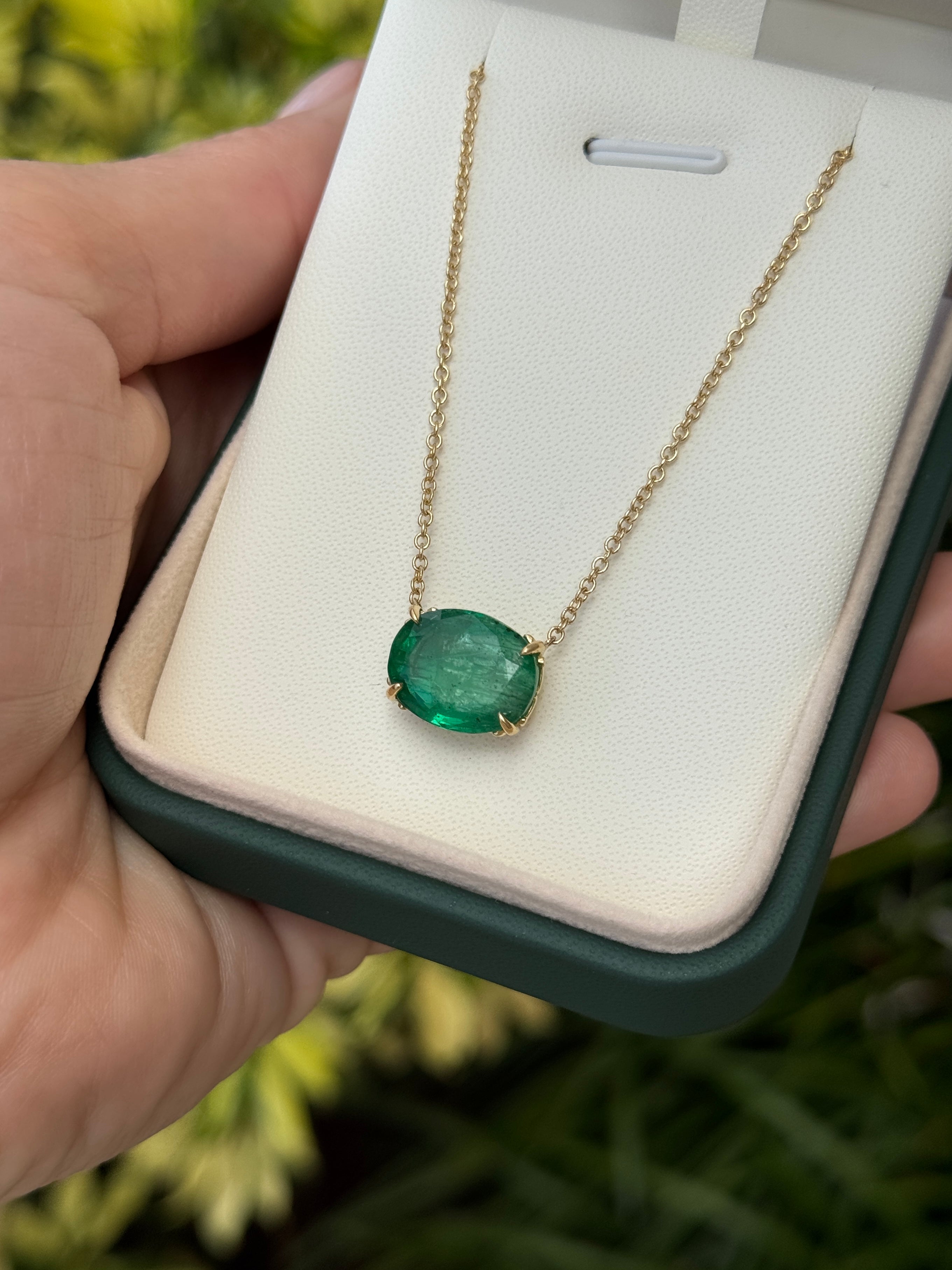 18K gold emerald necklace with 6.80ct oval natural emeralds and fleur de lis station design by JR Colombian Emeralds.