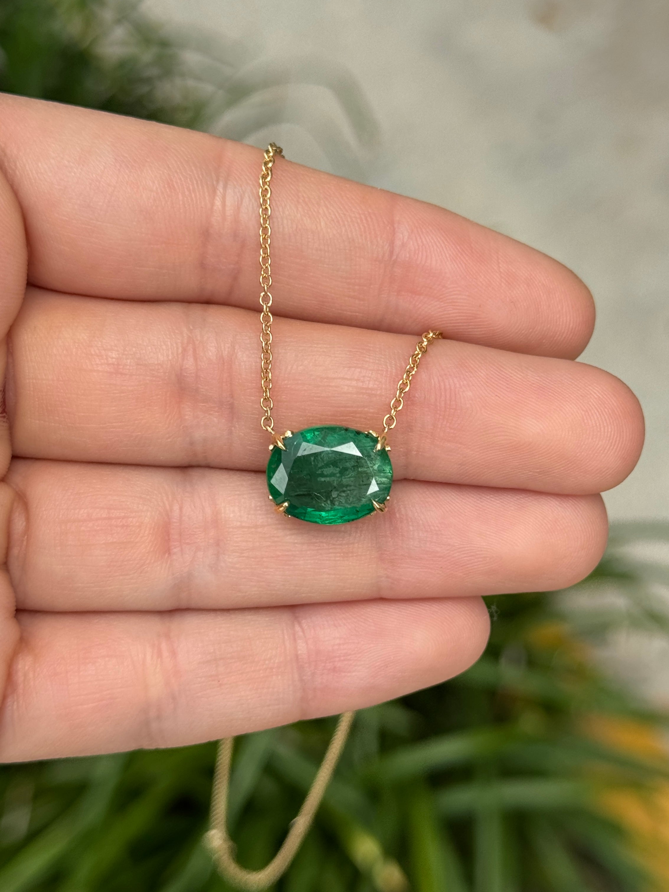 18K gold necklace with a 6.80ct natural emerald oval pendant featuring fleur de lis design by JR Colombian Emeralds