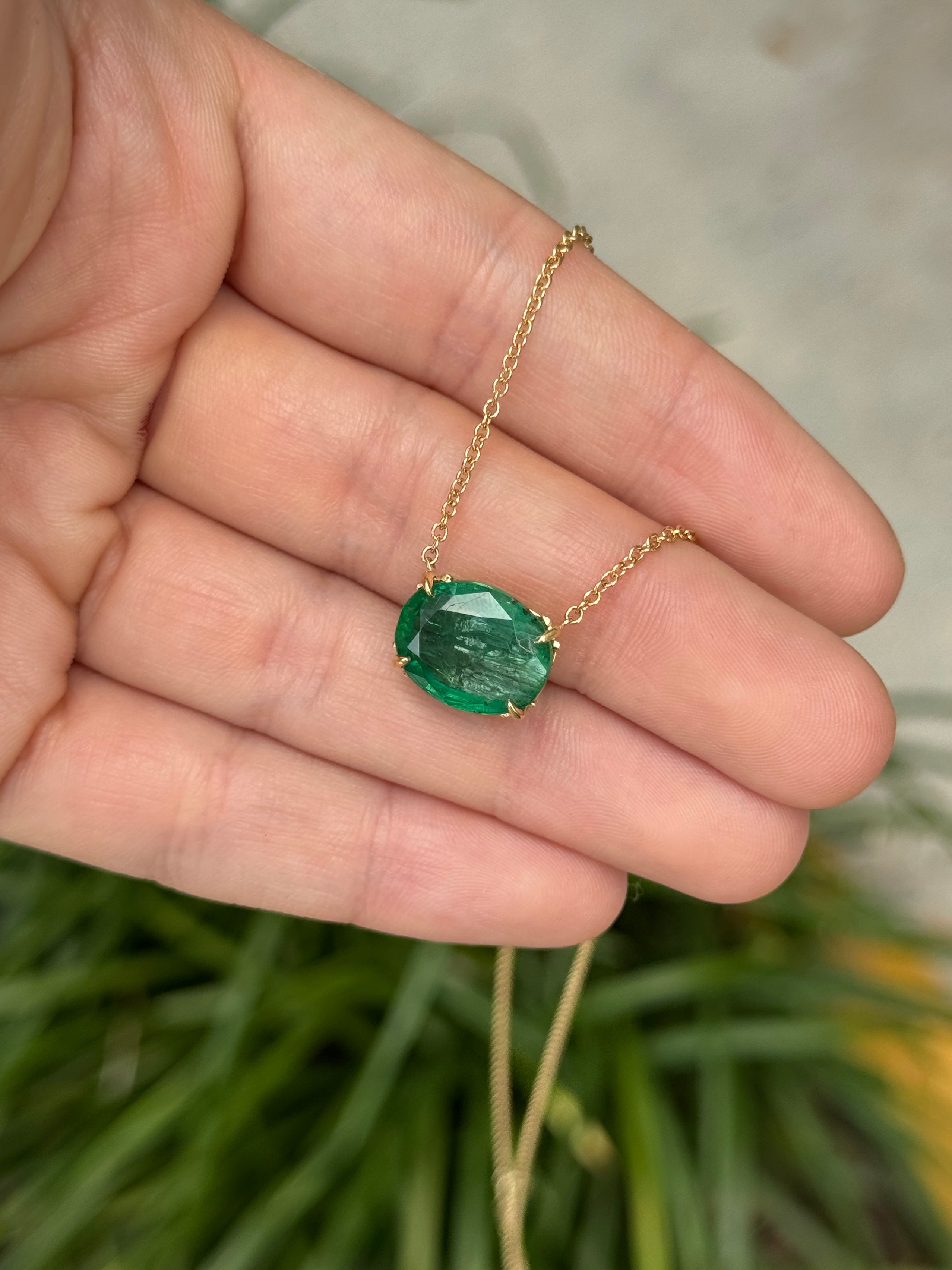 18K gold emerald necklace with 6.80ct oval green emeralds and fleur de lis station design by JR Colombian Emeralds