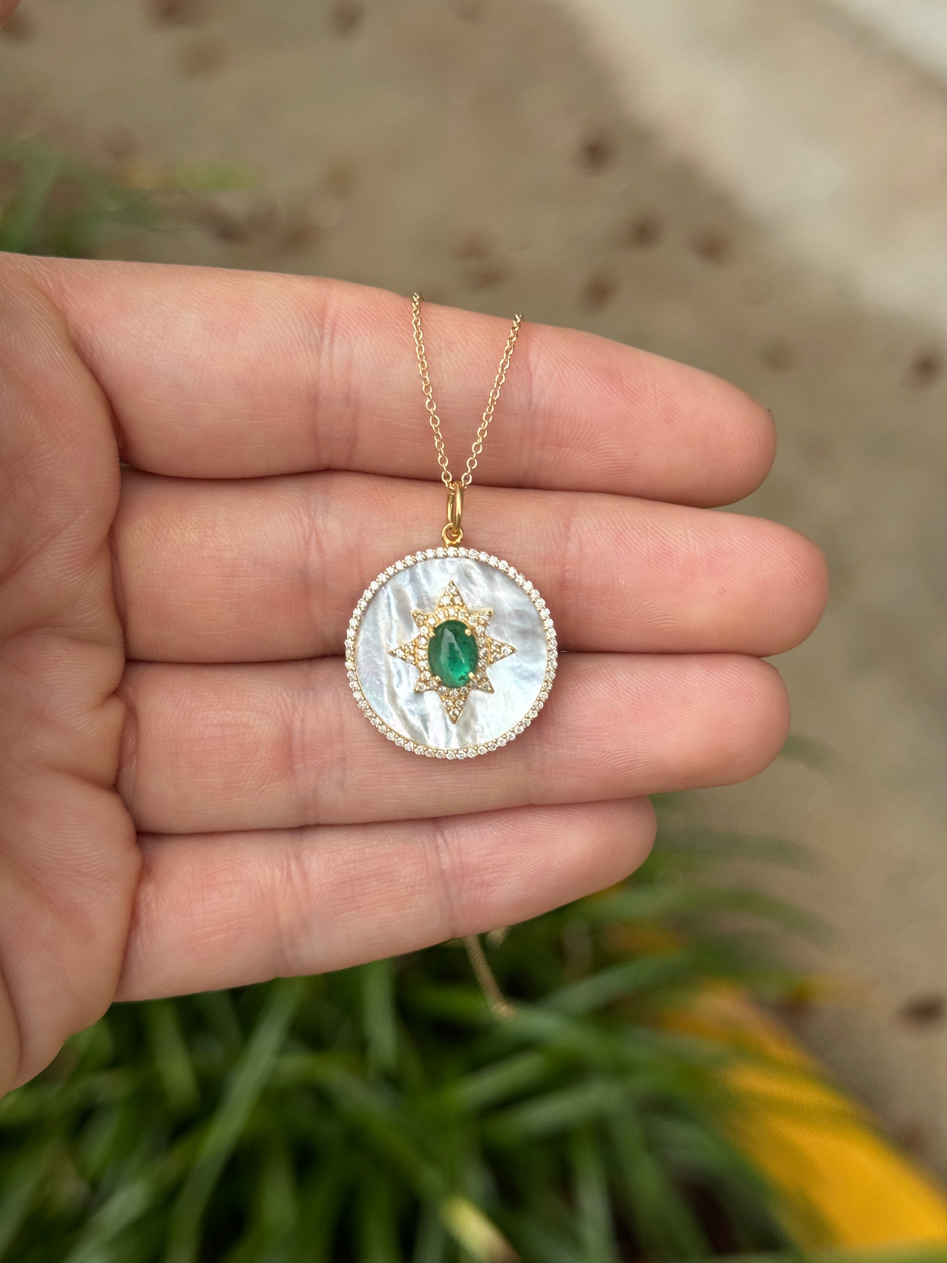 14K emerald cabochon and mother of pearl starburst medallion with diamond halo, jewelry piece from JR Colombian Emeralds.