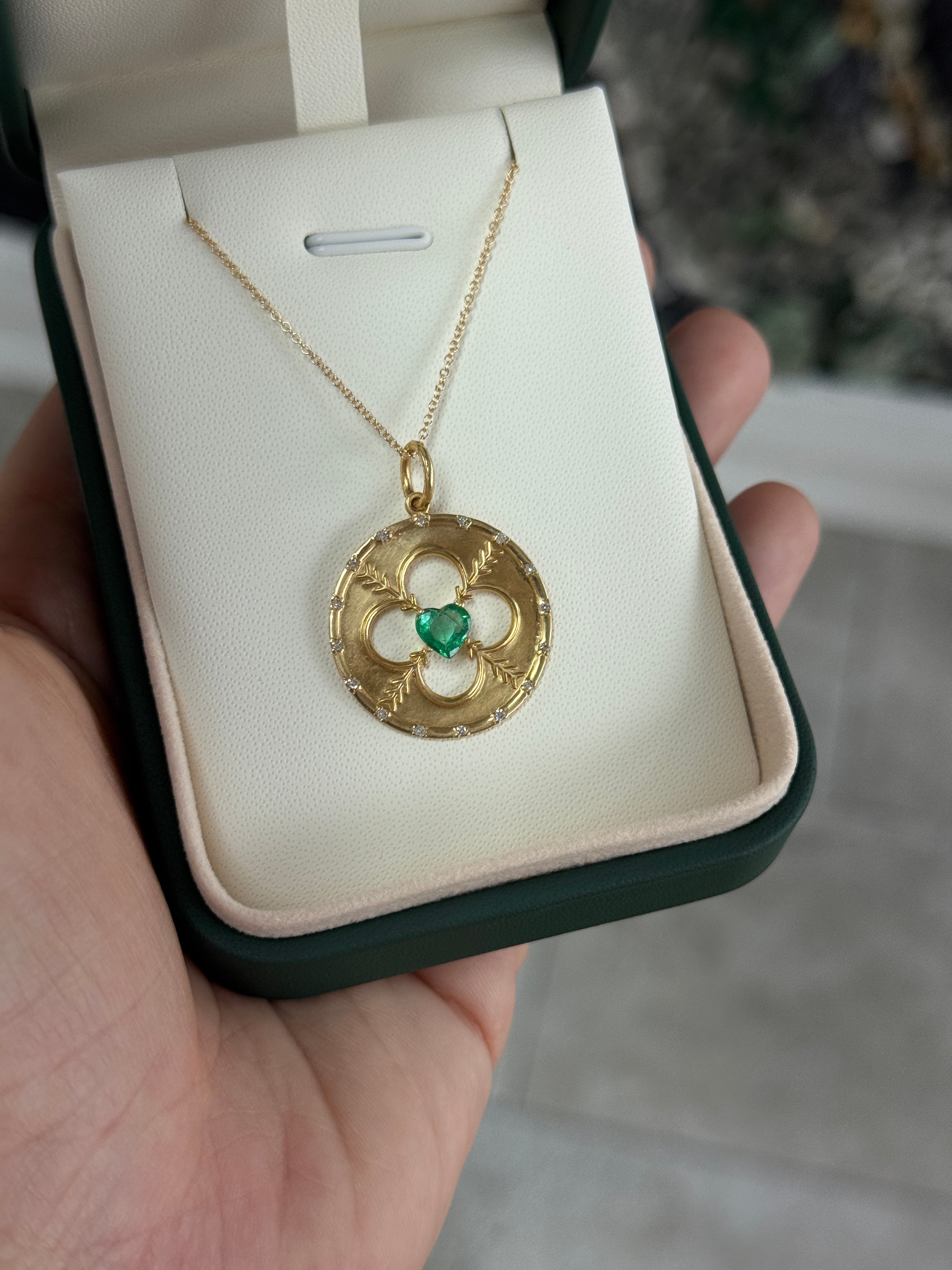 14K gold heart-shaped emerald and diamond motif medallion pendant with 0.86 carats total weight from JR Colombian Emeralds