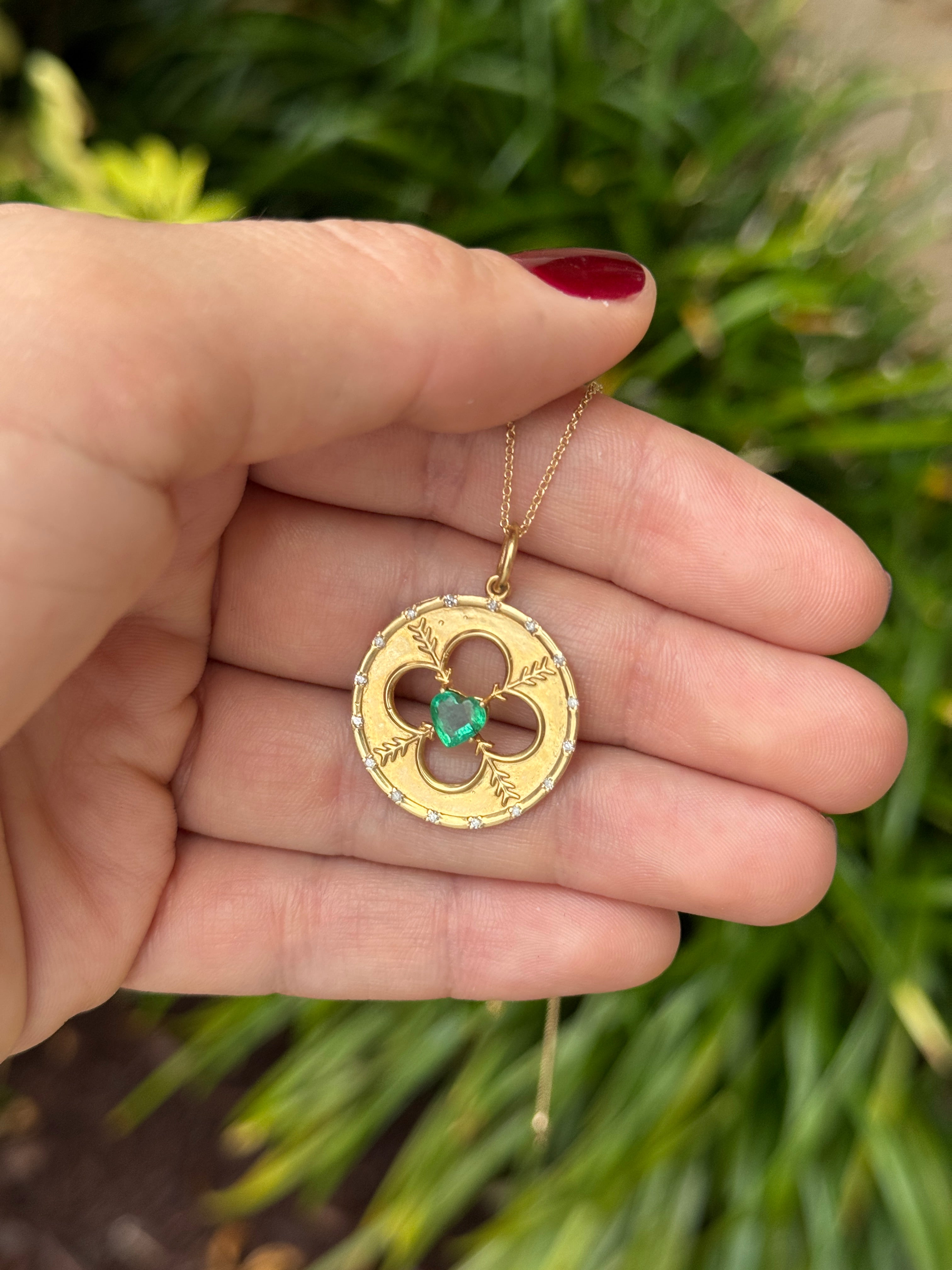 14K gold heart cut emerald and diamond motif medallion pendant with 0.86 carats total weight by JR Colombian Emeralds.