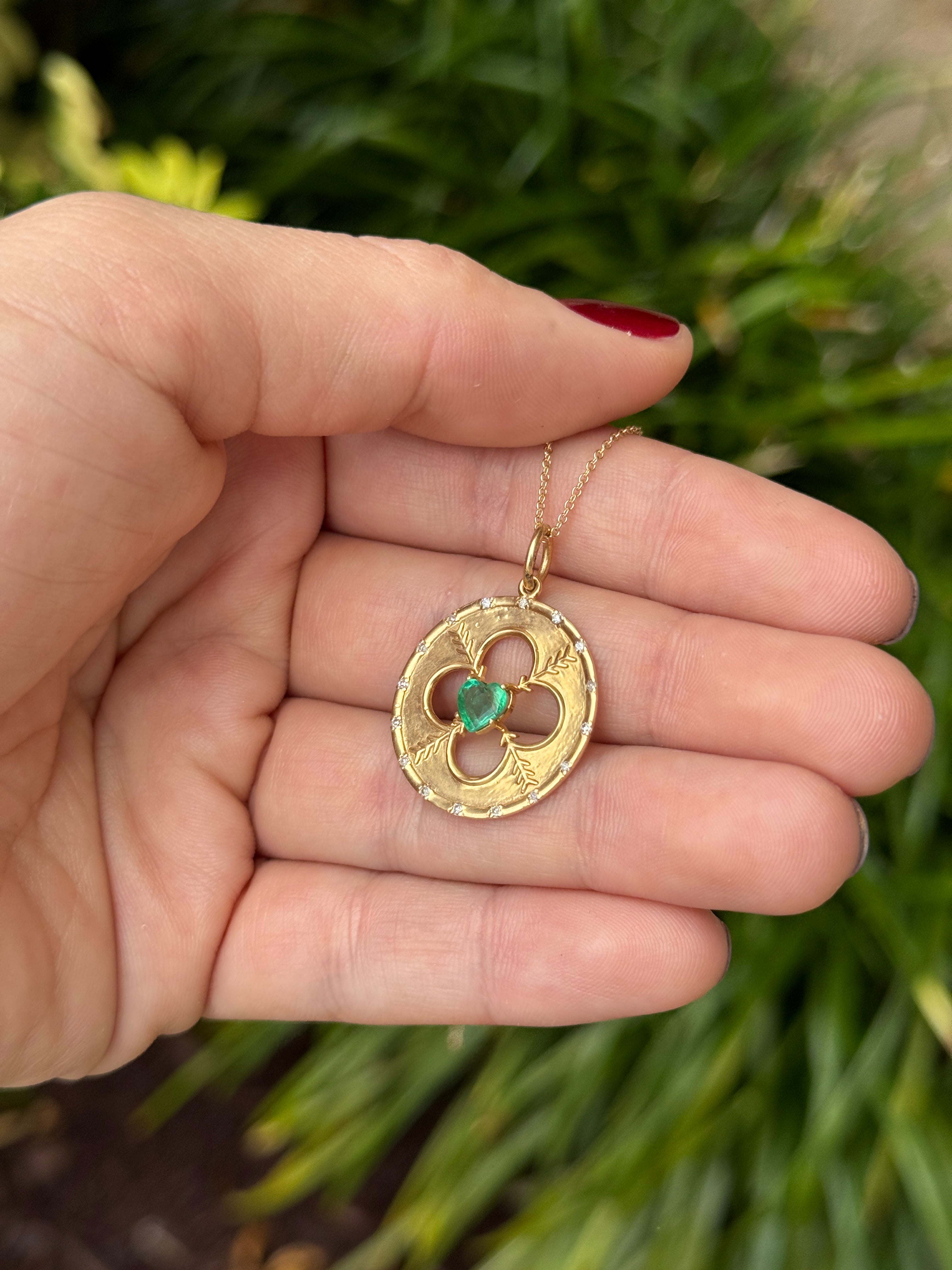 14K gold medallion pendant with heart-cut emerald and diamond accents, featuring a natural gemstone design by JR Colombian Emeralds.