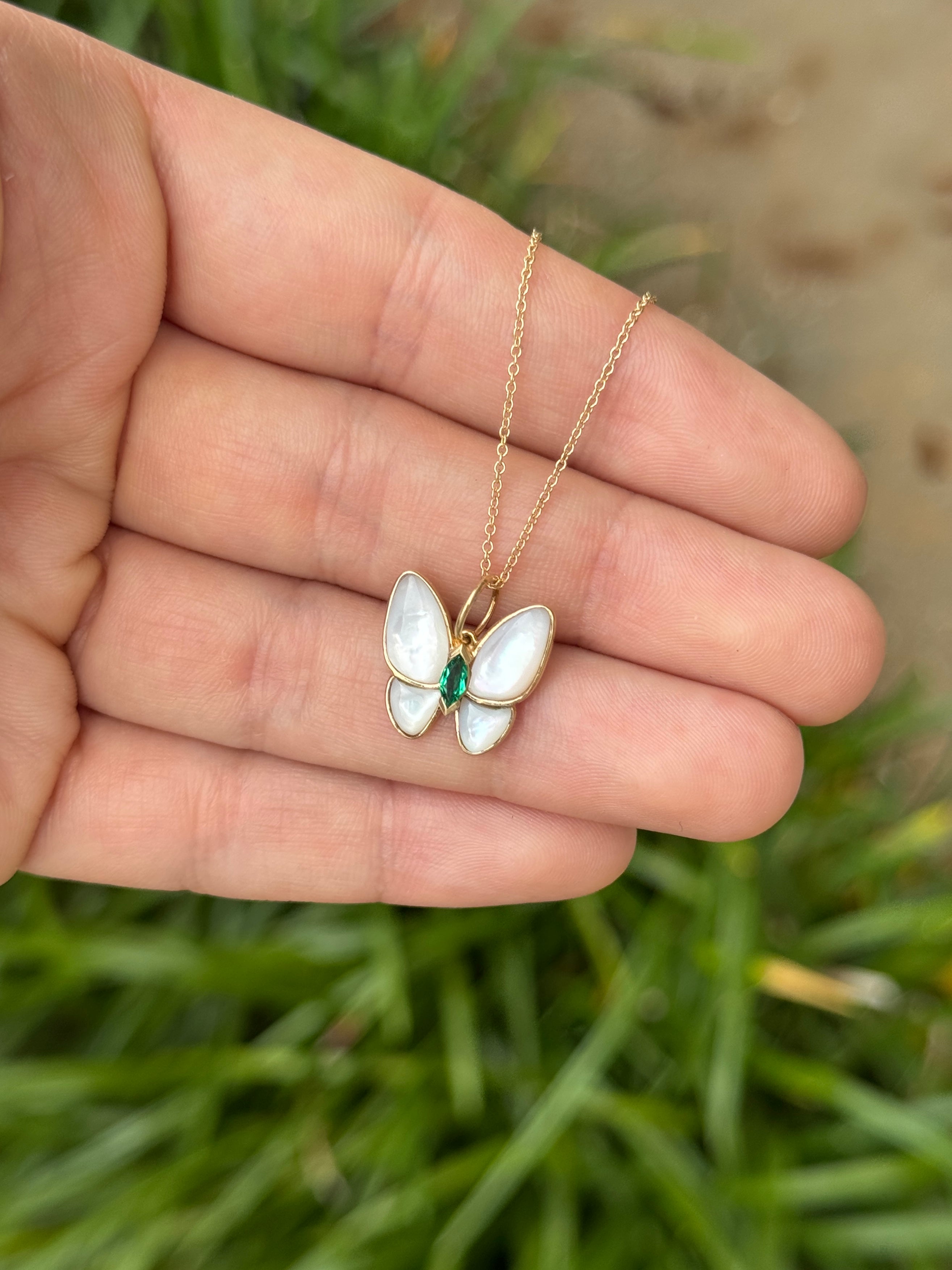 14K gold butterfly pendant with 2.90tcw marquise emeralds and mother of pearl accents, from JR Colombian Emeralds.