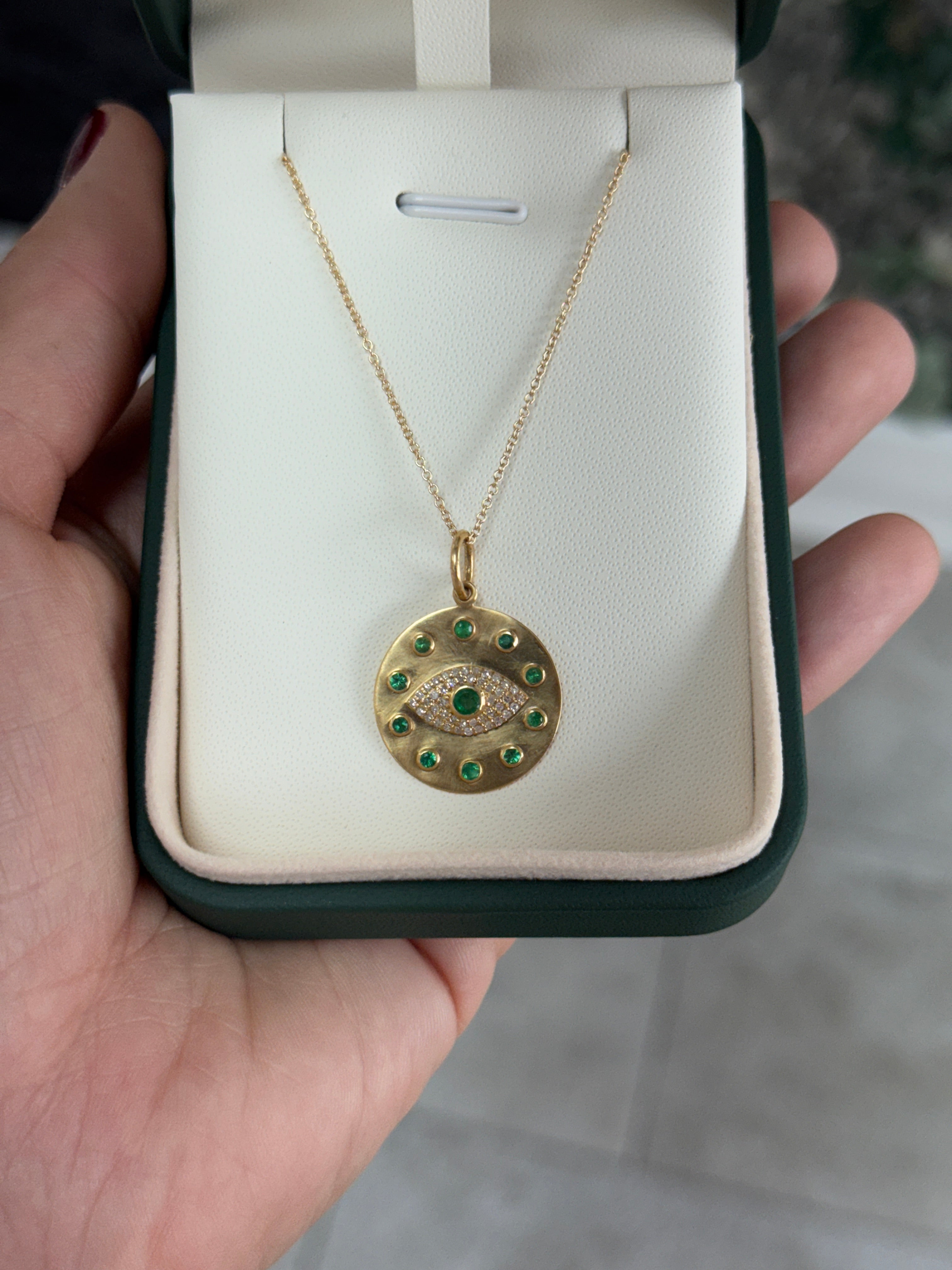 14K natural emerald and diamond evil eye protection charm pendant with intricate design, crafted by JR Colombian Emeralds.