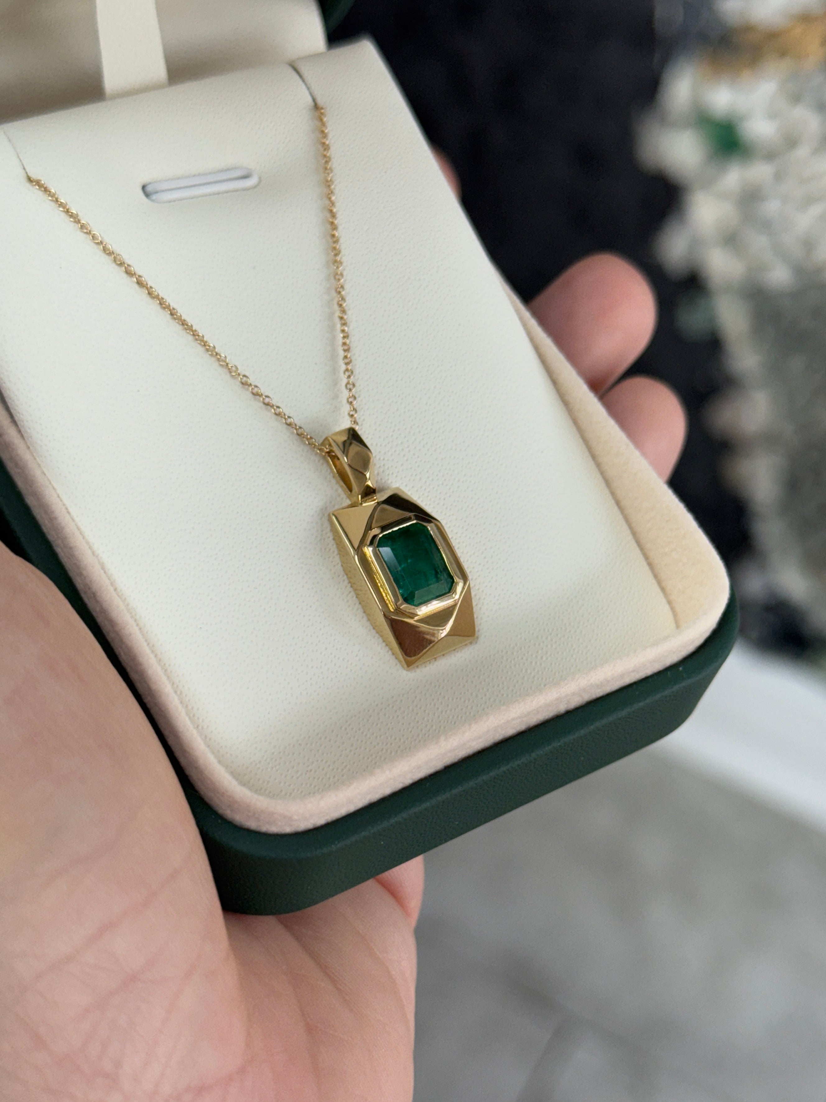 Emerald dog tag pendant with 2.35 carats in 14K gold from JR Colombian Emeralds, featuring a vibrant green emerald gemstone.